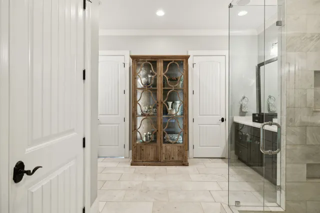 a spacious bathroom with a granite countertop sink and a mirror