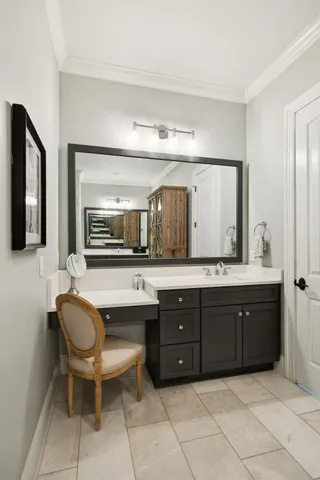 a bathroom with a sink mirror and a toilet