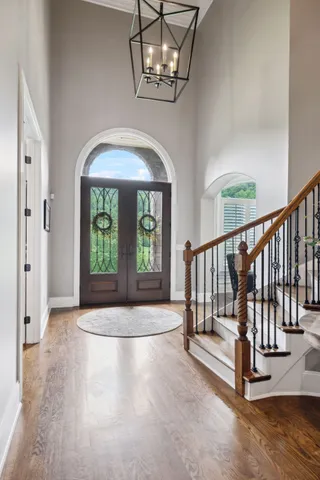 a living room with furniture a clock and a window