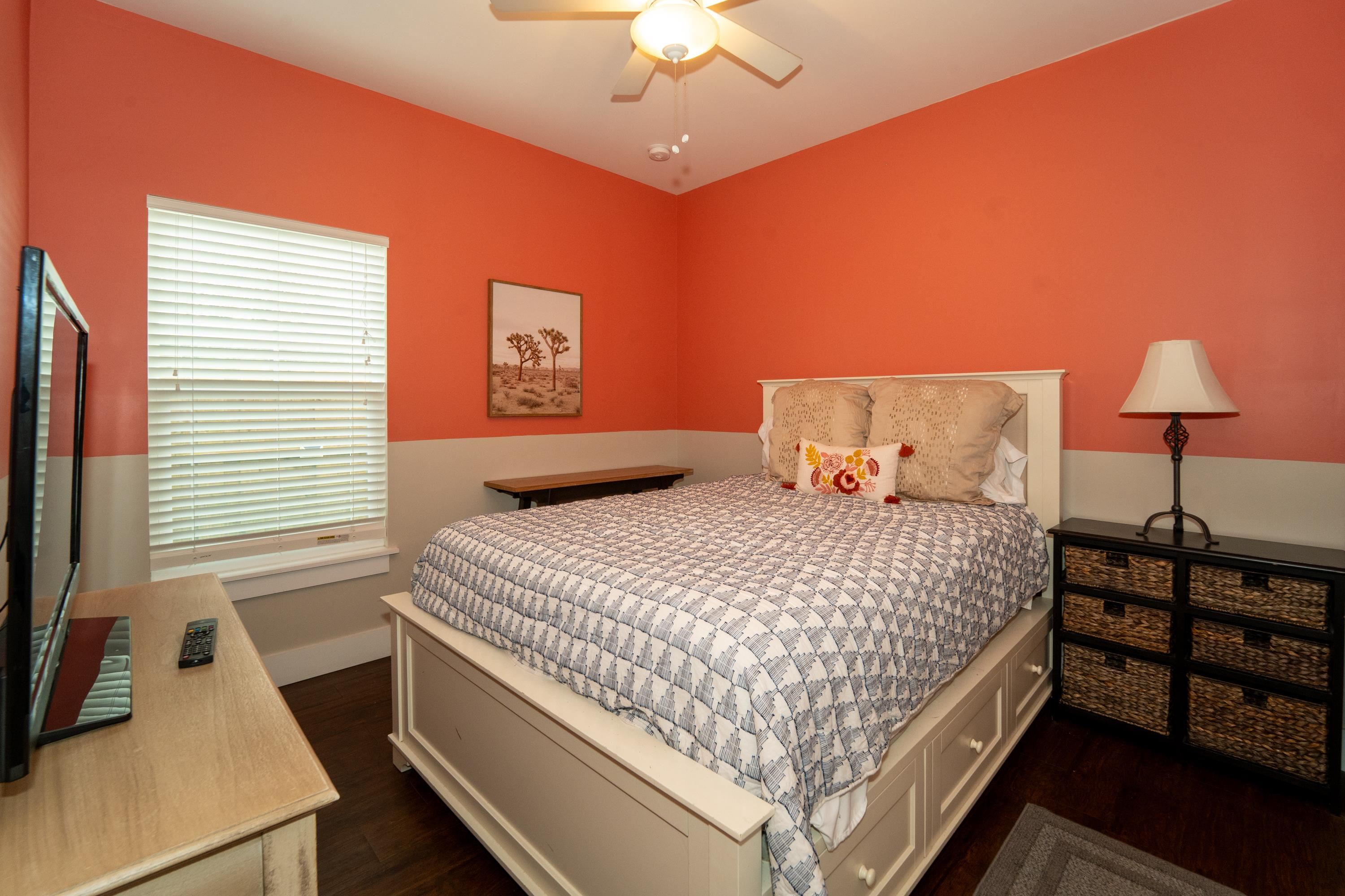 228 Herada Street St. Augustine, FL 32080 - Photo 20 of 32 a bedroom with a bed and a desk