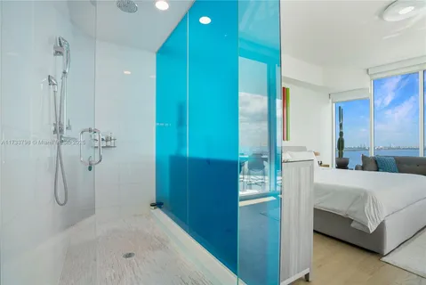 a bathroom with a tub and shower