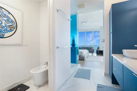 a en suite bathroom with a toilet a sink and mirror
