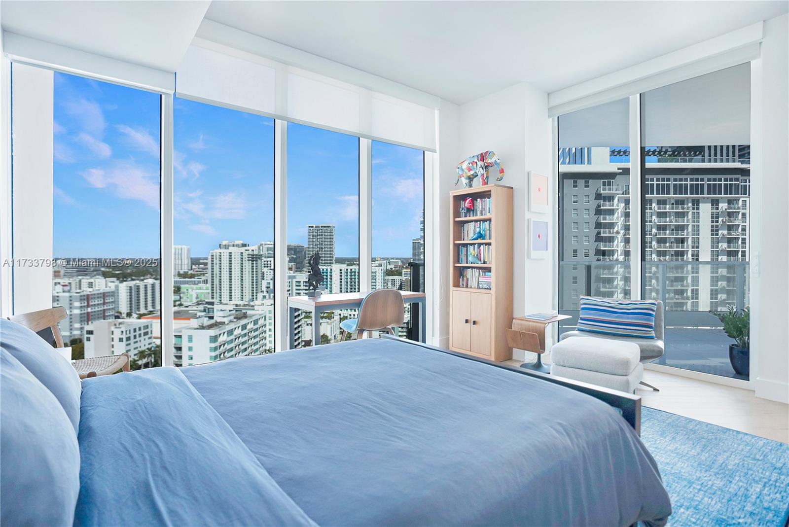2020 North Bayshore Drive, Unit 2302 Miami, FL 33137 - Photo 28 of 57 a bedroom with a large window and a balcony