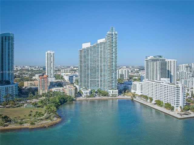 a view of a swimming pool with chairs