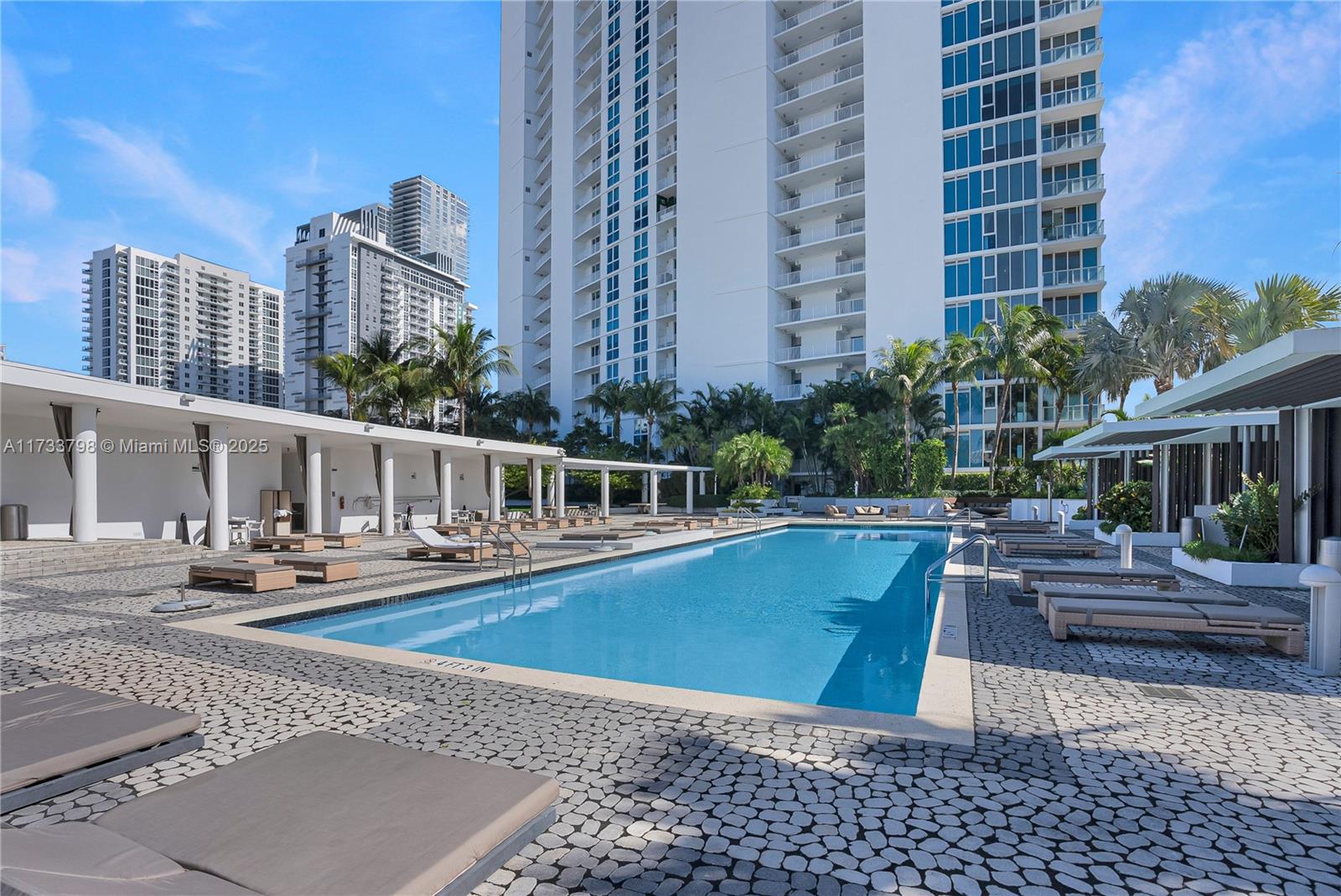 2020 North Bayshore Drive, Unit 2302 Miami, FL 33137 - Photo 48 of 57 a view of a swimming pool with chairs