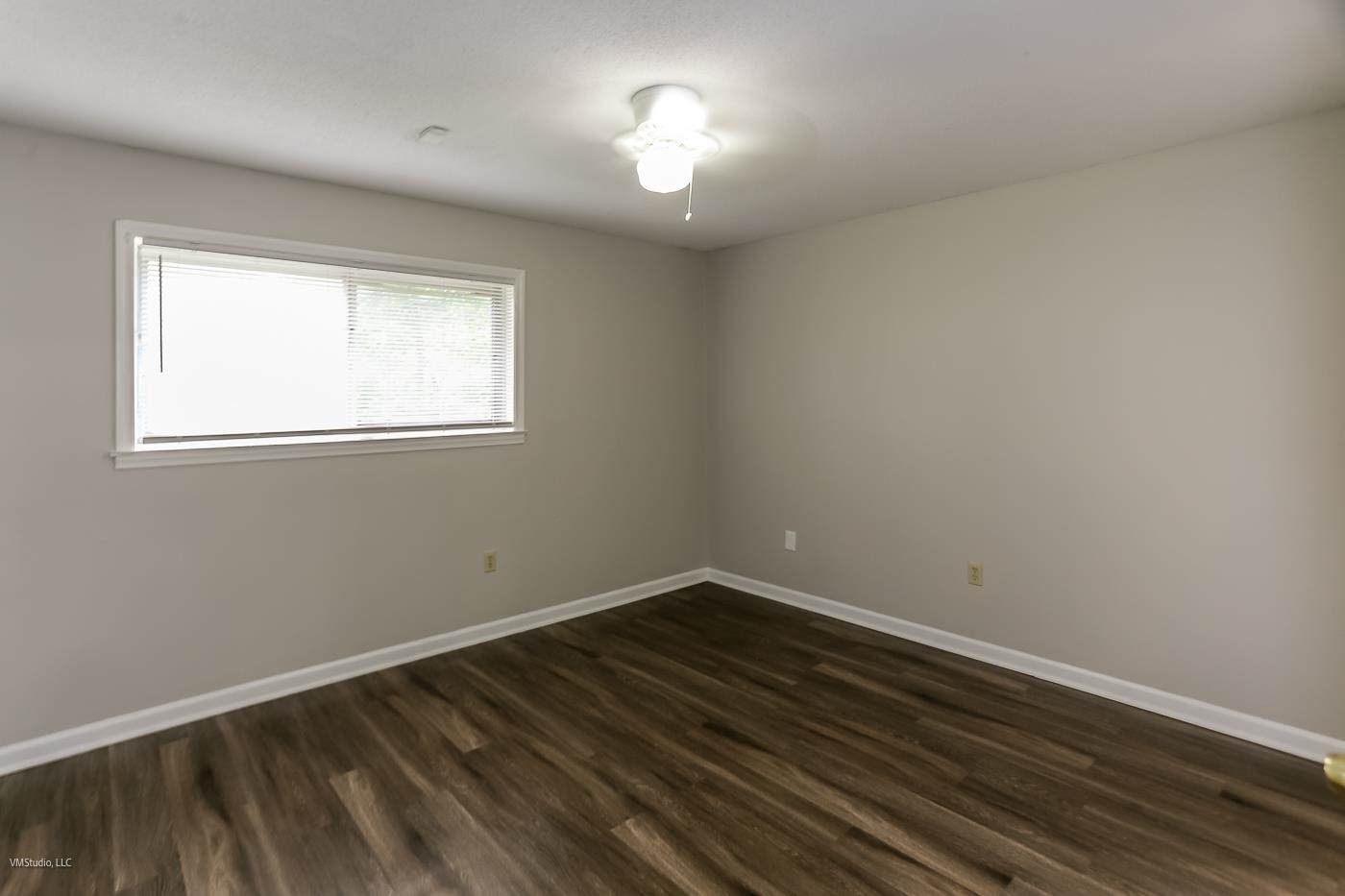 5217 Yale Road Memphis, TN 38134 - Photo 13 of 30 Empty room with ceiling fan and dark hardwood / wood-style flooring