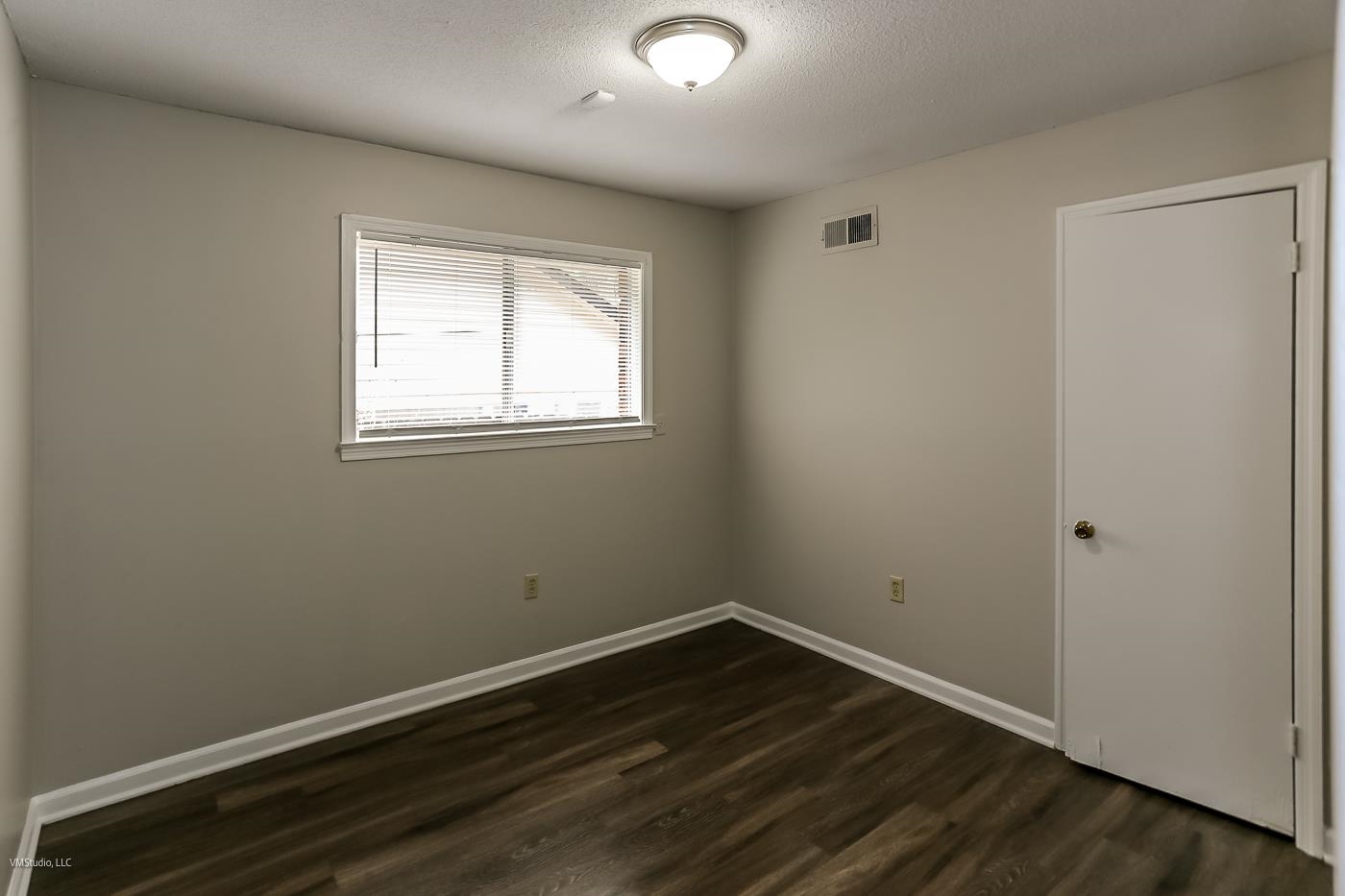 5217 Yale Road Memphis, TN 38134 - Photo 19 of 30 Empty room featuring dark wood-type flooring