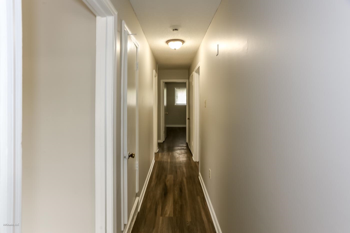 5217 Yale Road Memphis, TN 38134 - Photo 24 of 30 Hallway featuring dark wood-type flooring