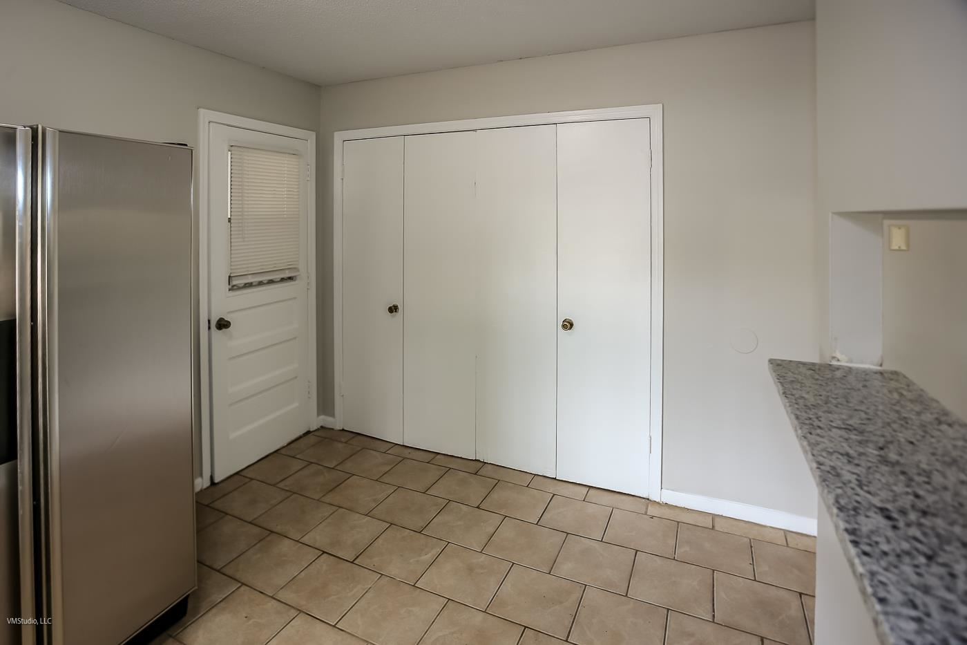 5217 Yale Road Memphis, TN 38134 - Photo 30 of 30 Kitchen featuring light tile patterned flooring and stainless steel fridge
