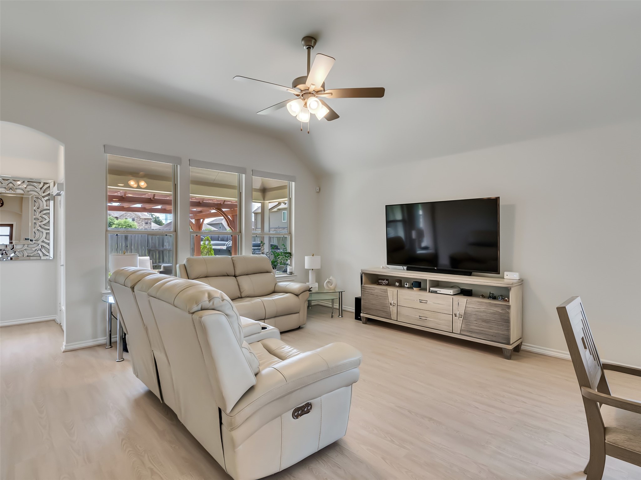 27997 Lone Hollow Lane Spring, TX 77386 - Photo 30 of 45 a living room with furniture and a flat screen tv