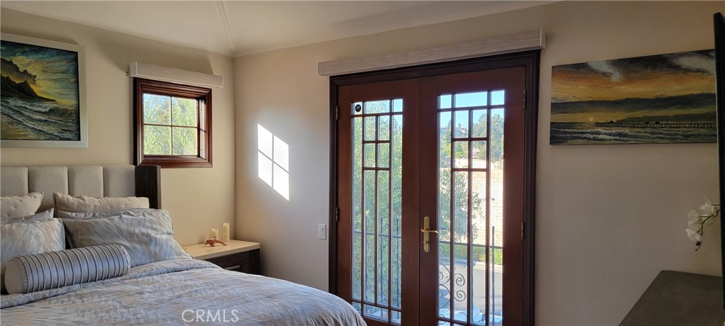 34283 Via Lopez Dana Point, CA 92624 - Photo 25 of 36 Large Queen Bedroom with French Doors, New Bed and Linens, and 65" Smart TV