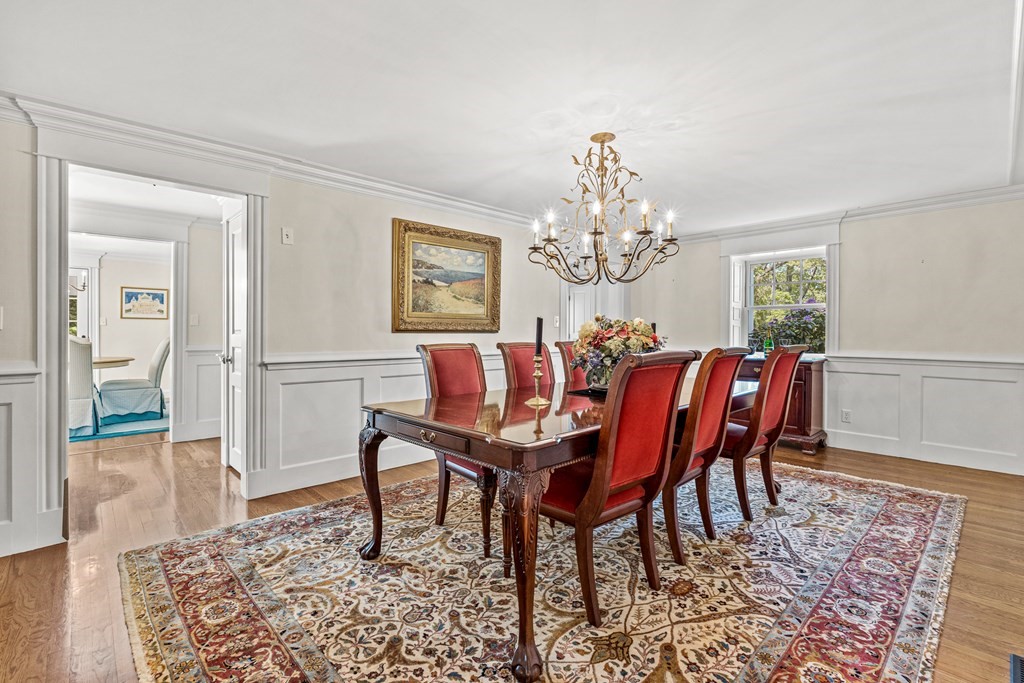 3 Ordway Road Wellesley, MA 02481 - Photo 13 of 38 a dining room with furniture a rug and a chandelier