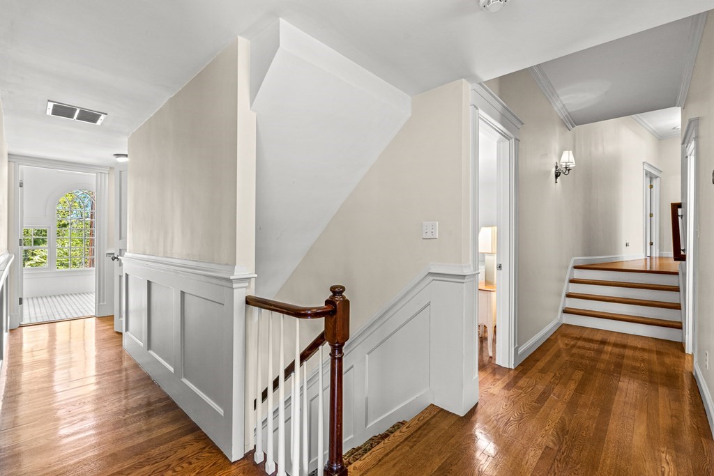 3 Ordway Road Wellesley, MA 02481 - Photo 25 of 38 a view of a hallway with wooden floor and staircase