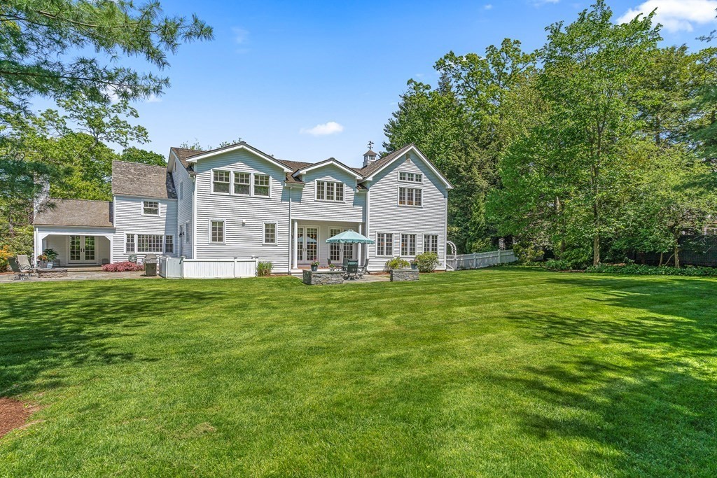 3 Ordway Road Wellesley, MA 02481 - Photo 6 of 38 a front view of a house with a garden