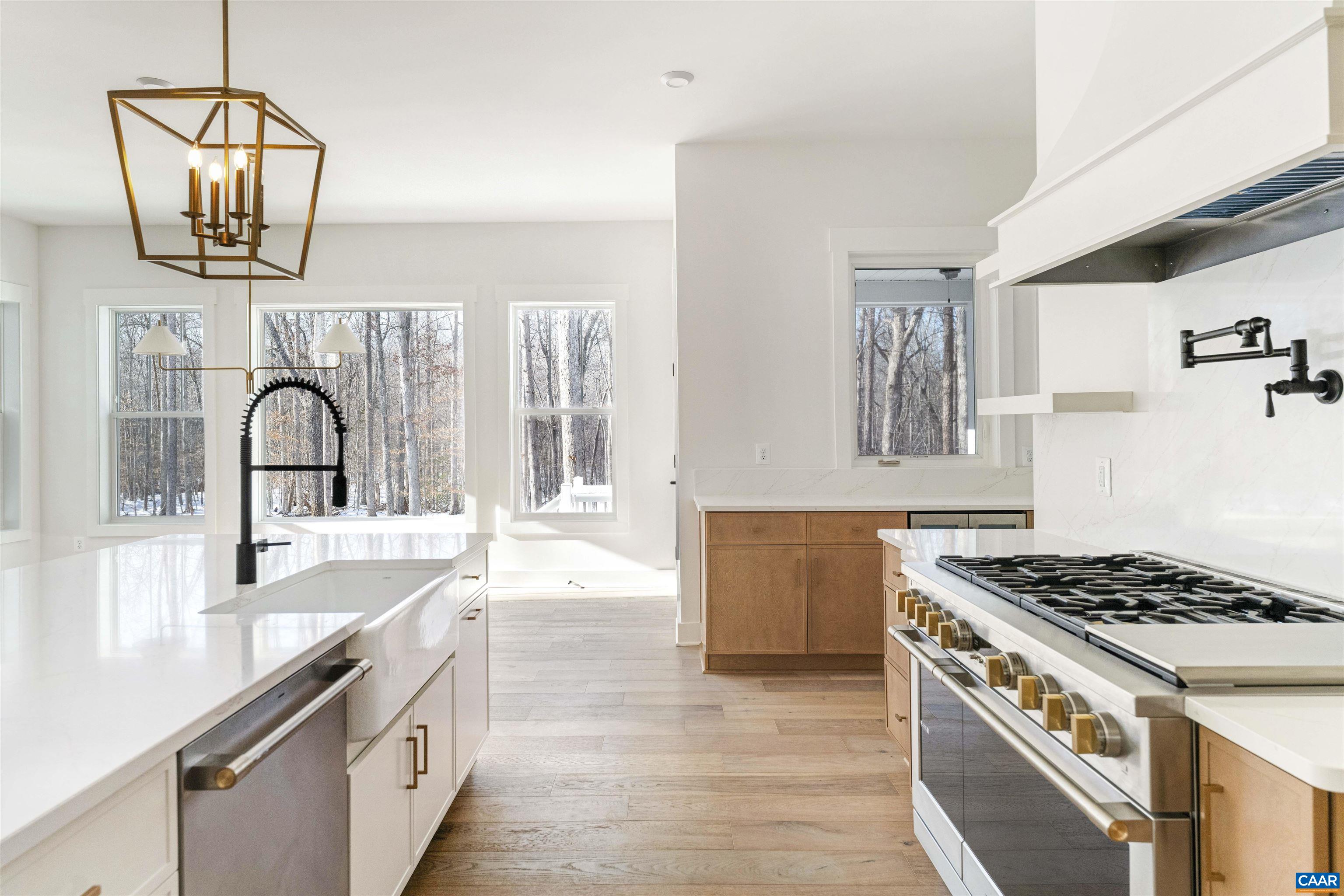 1000 Broad Axe Road Charlottesville, VA 22903 - Photo 16 of 58 a kitchen with granite countertop a sink stove and cabinets