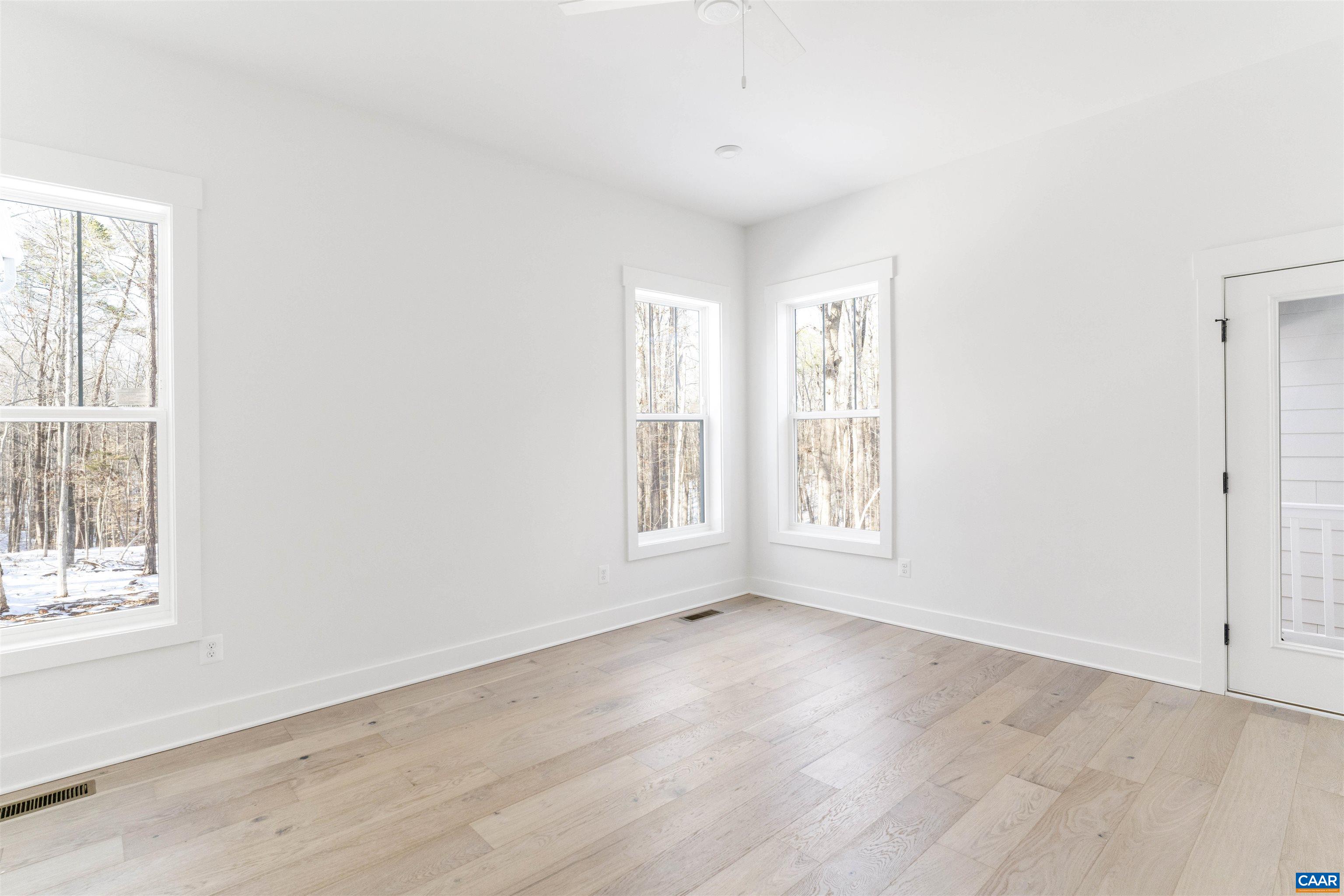 1000 Broad Axe Road Charlottesville, VA 22903 - Photo 21 of 58 an empty room with wooden floor and windows