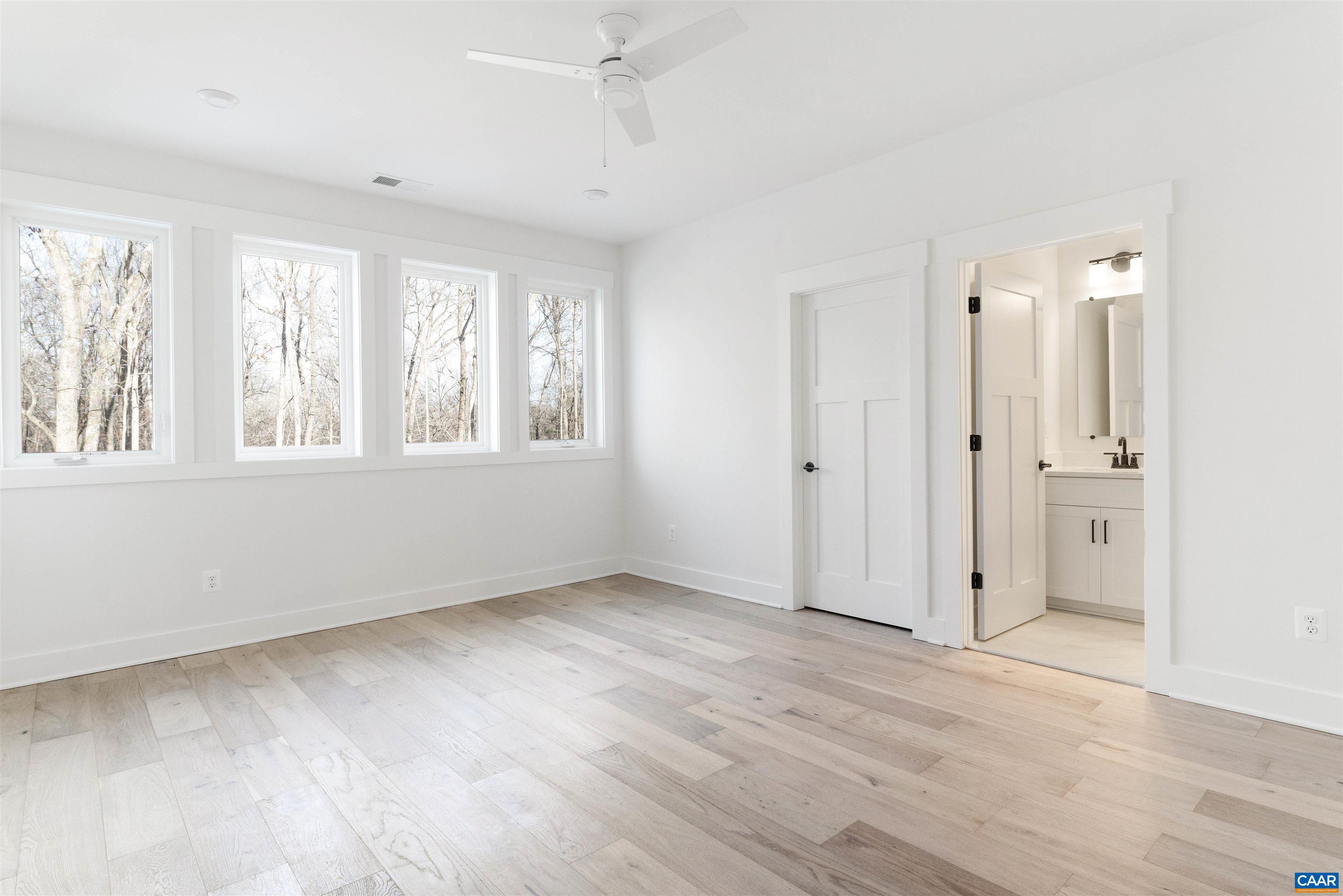 1000 Broad Axe Road Charlottesville, VA 22903 - Photo 41 of 58 an empty room with wooden floor and windows