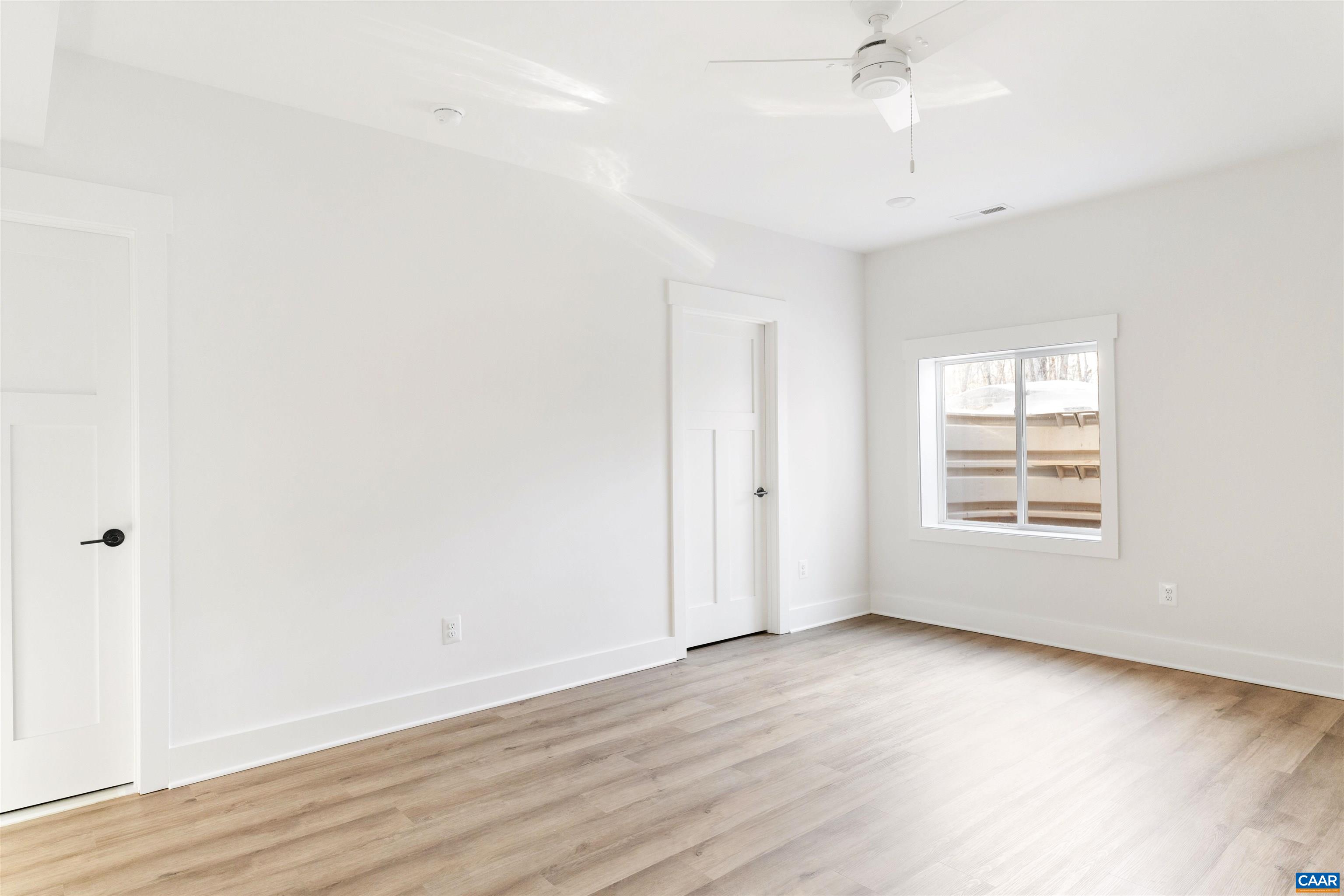1000 Broad Axe Road Charlottesville, VA 22903 - Photo 50 of 58 an empty room with wooden floor and windows