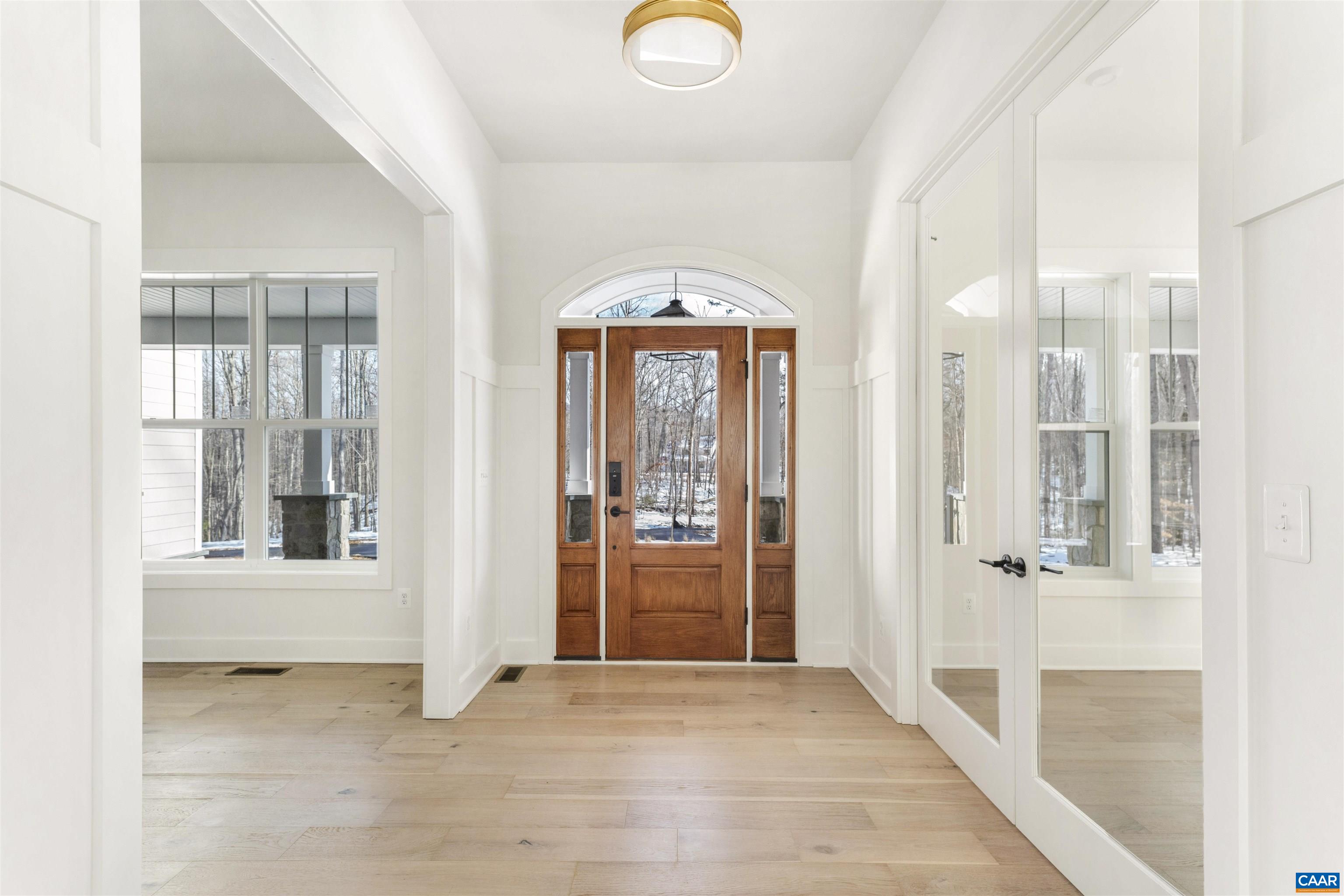 1000 Broad Axe Road Charlottesville, VA 22903 - Photo 5 of 58 a view of an entryway with wooden floor and mirror