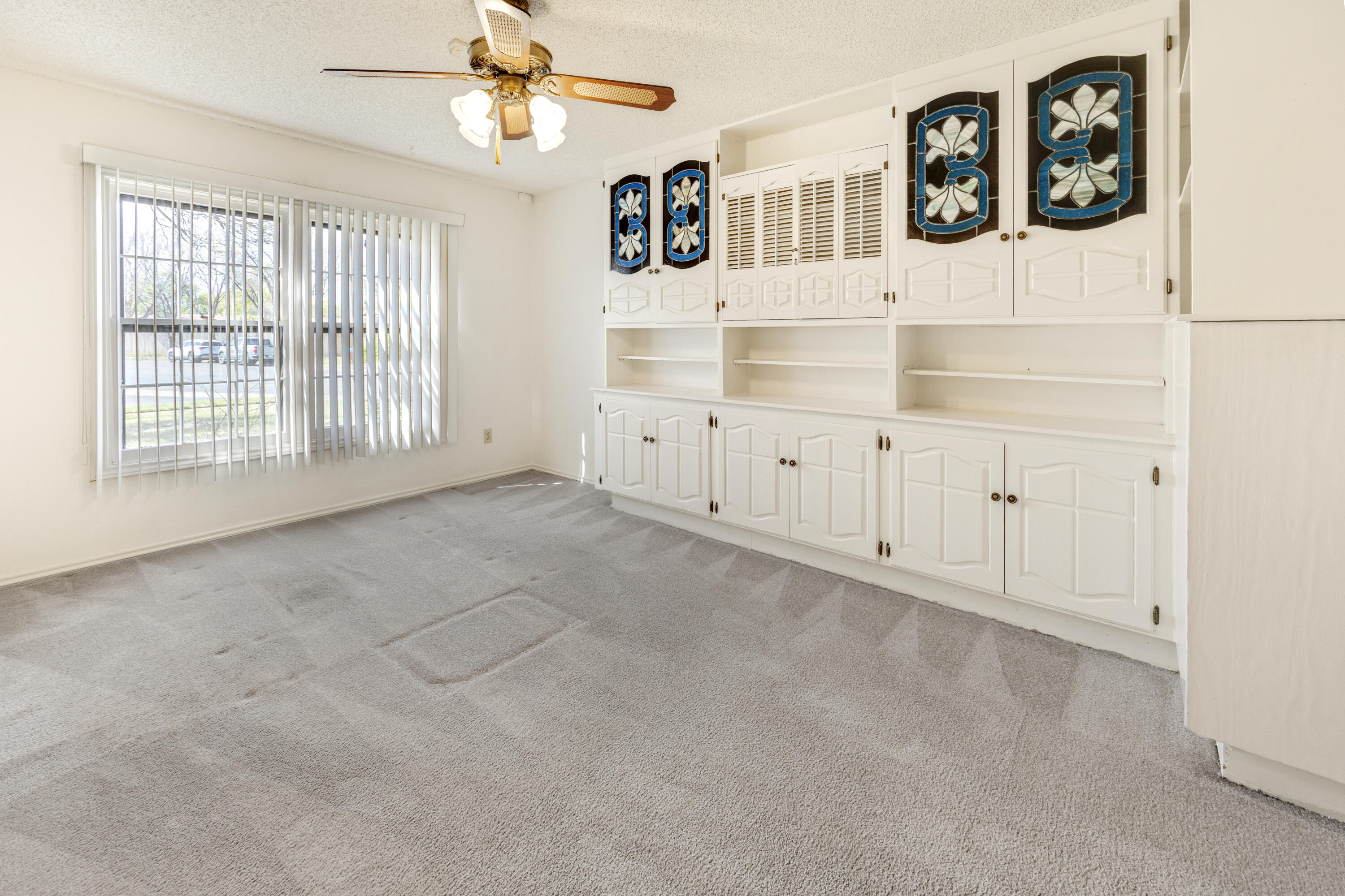 4416 62nd Street Lubbock, TX 79414 - Photo 17 of 70 an empty room with windows and cabinet
