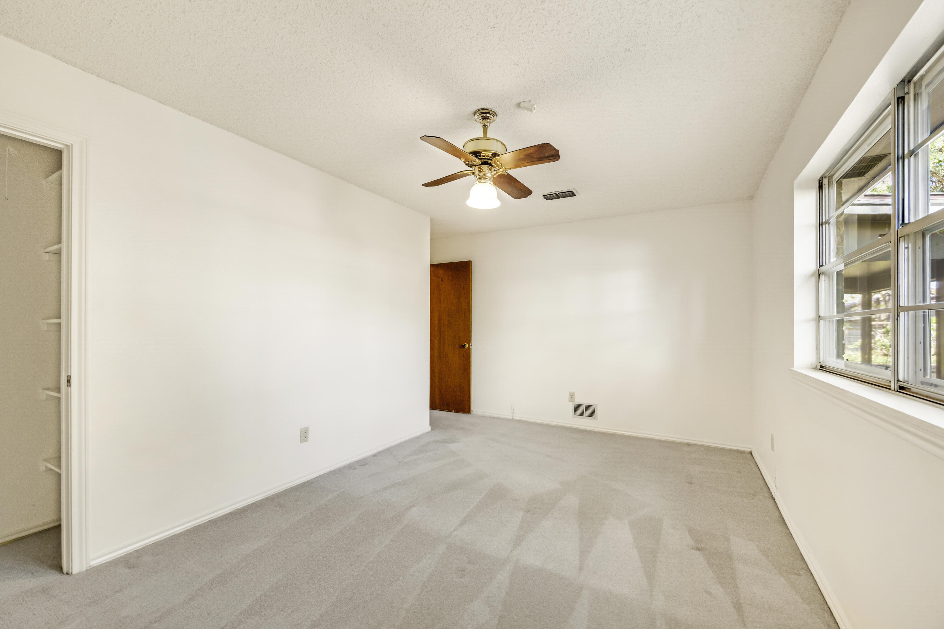 4416 62nd Street Lubbock, TX 79414 - Photo 19 of 70 a view of an empty room with a window