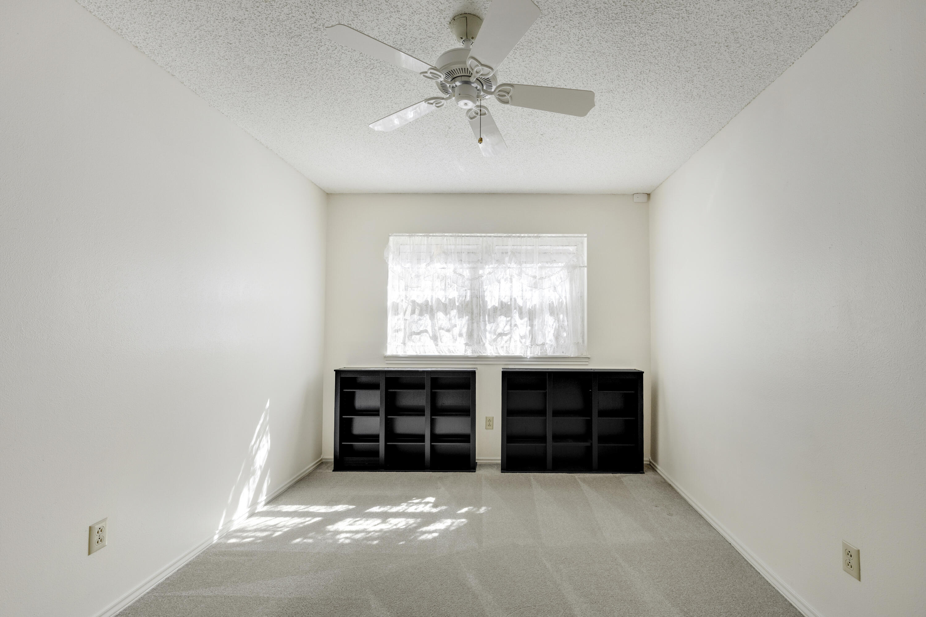 4416 62nd Street Lubbock, TX 79414 - Photo 24 of 70 an empty room with windows and cabinet