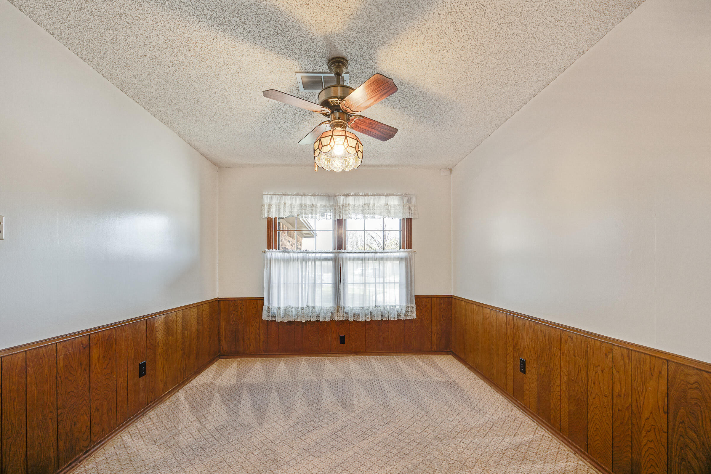 4416 62nd Street Lubbock, TX 79414 - Photo 27 of 70 a view of an empty room with a window