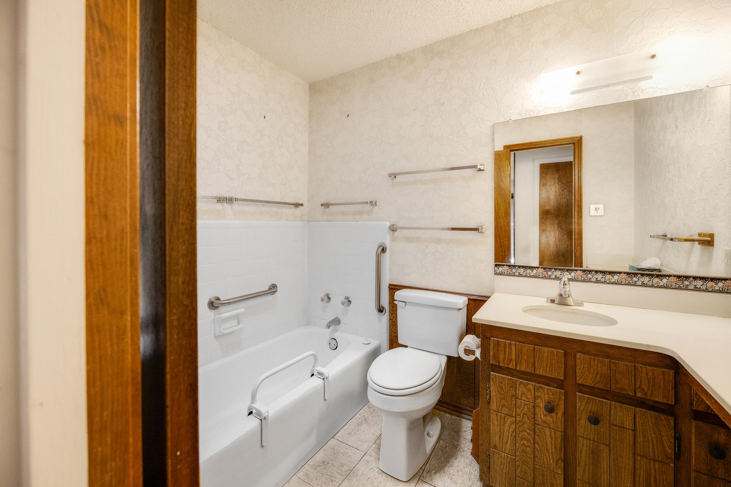 4416 62nd Street Lubbock, TX 79414 - Photo 32 of 70 a bathroom with a sink a toilet and shower