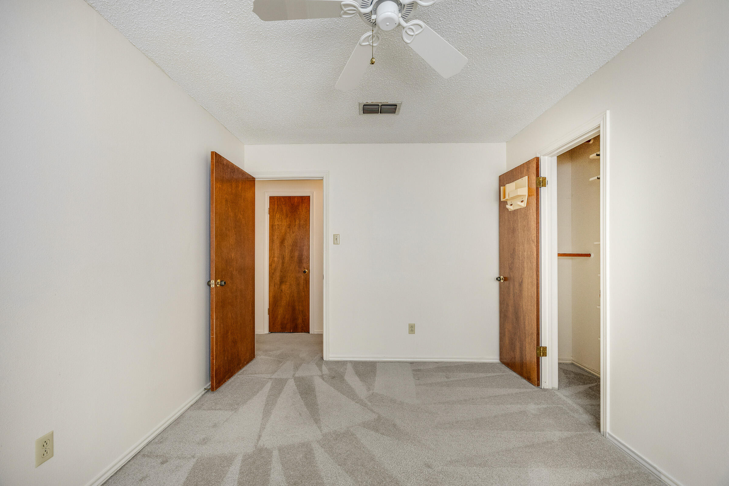 4416 62nd Street Lubbock, TX 79414 - Photo 33 of 70 an empty room with a ceiling fan