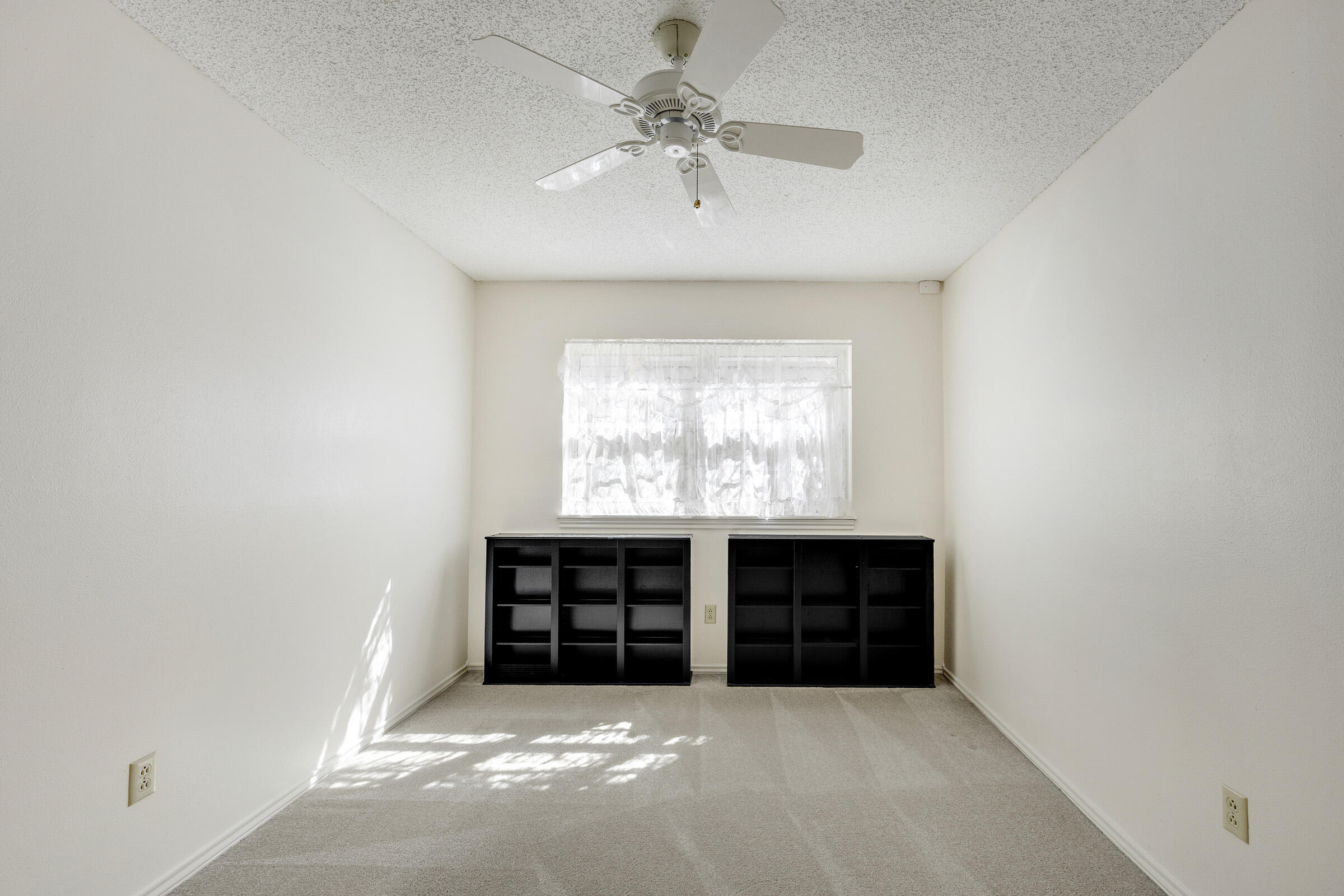 4416 62nd Street Lubbock, TX 79414 - Photo 35 of 70 an empty room with windows and cabinet