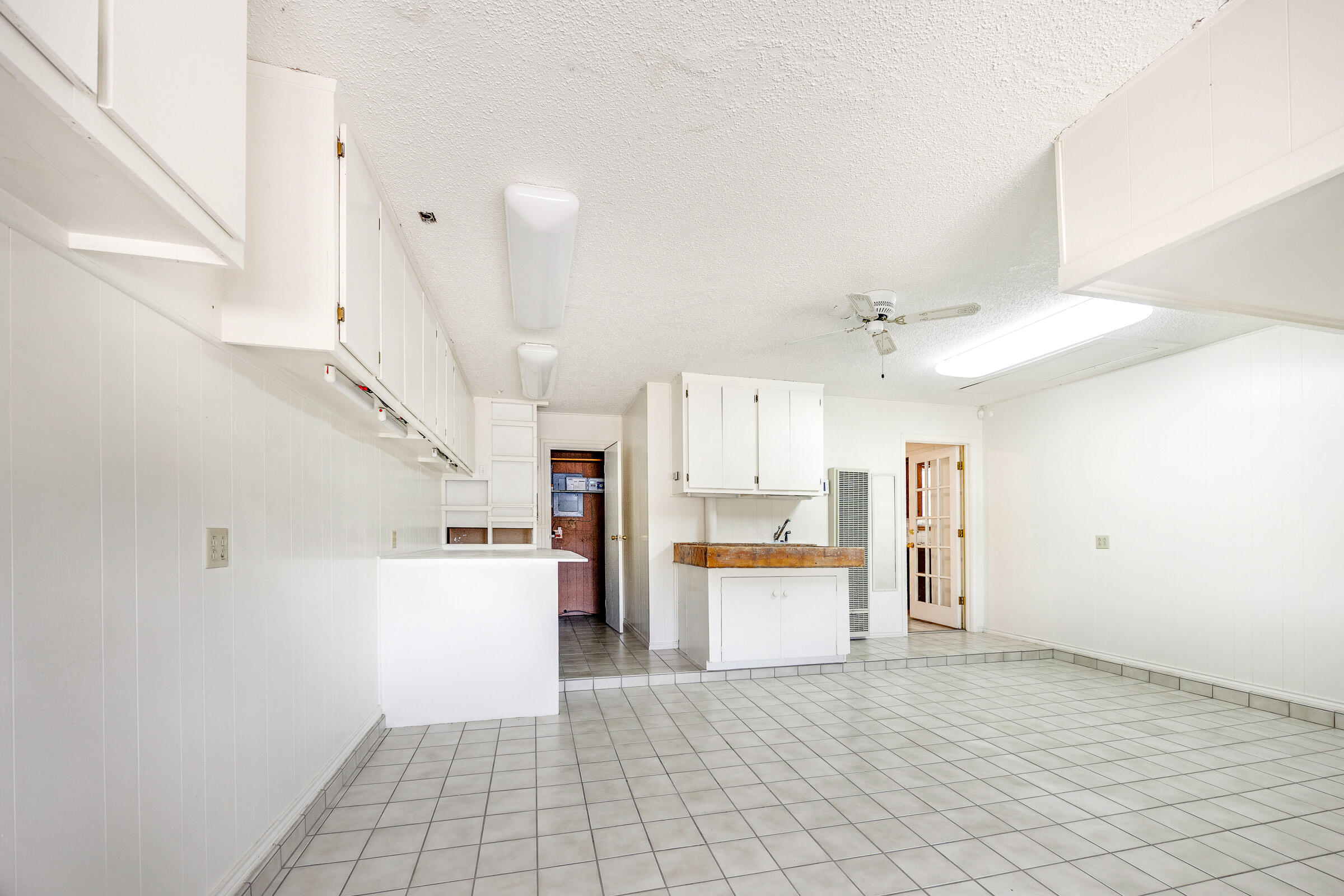 4416 62nd Street Lubbock, TX 79414 - Photo 39 of 70 a view of a kitchen with a sink and a refrigerator