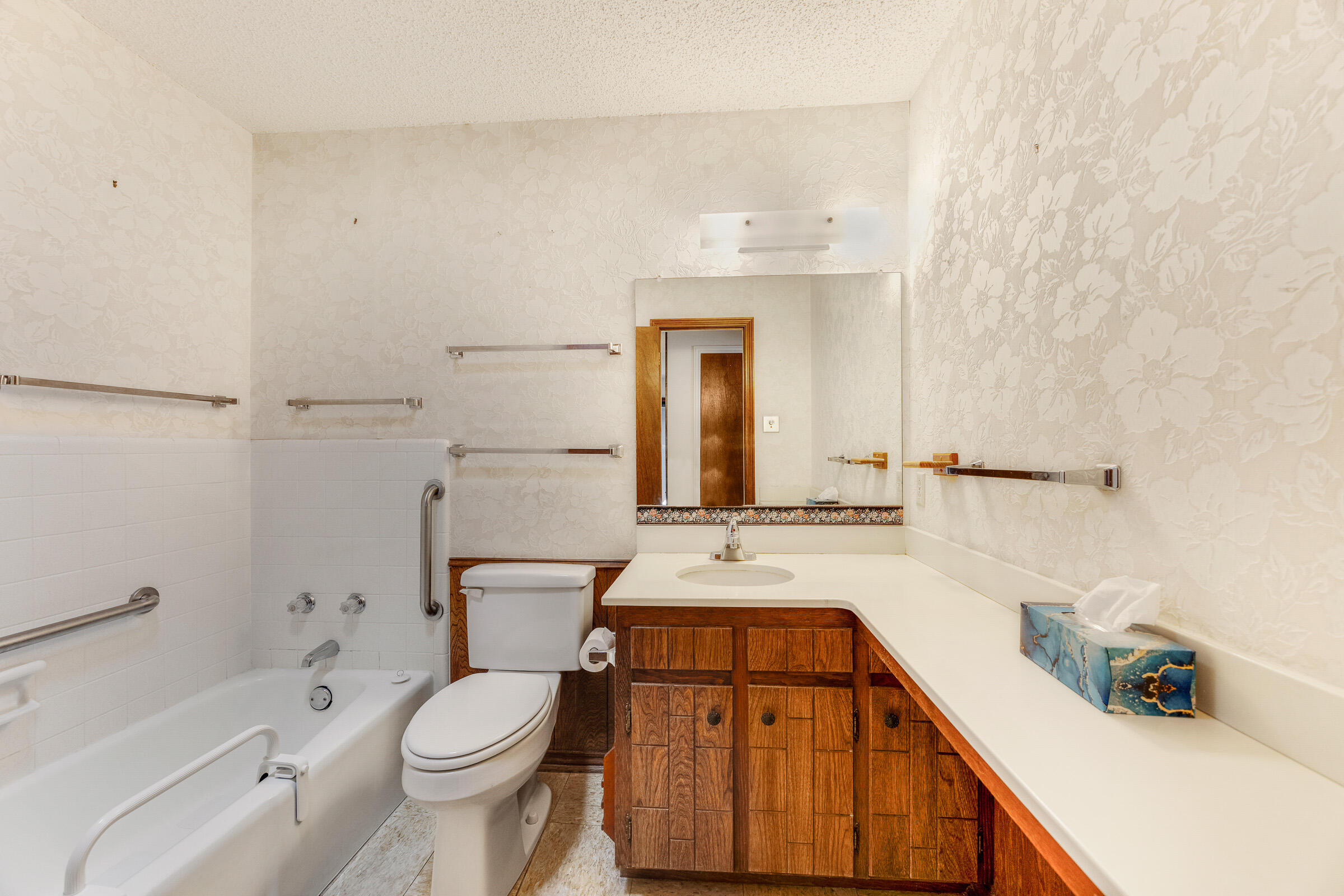 4416 62nd Street Lubbock, TX 79414 - Photo 41 of 70 a bathroom with a sink toilet vanity and shower