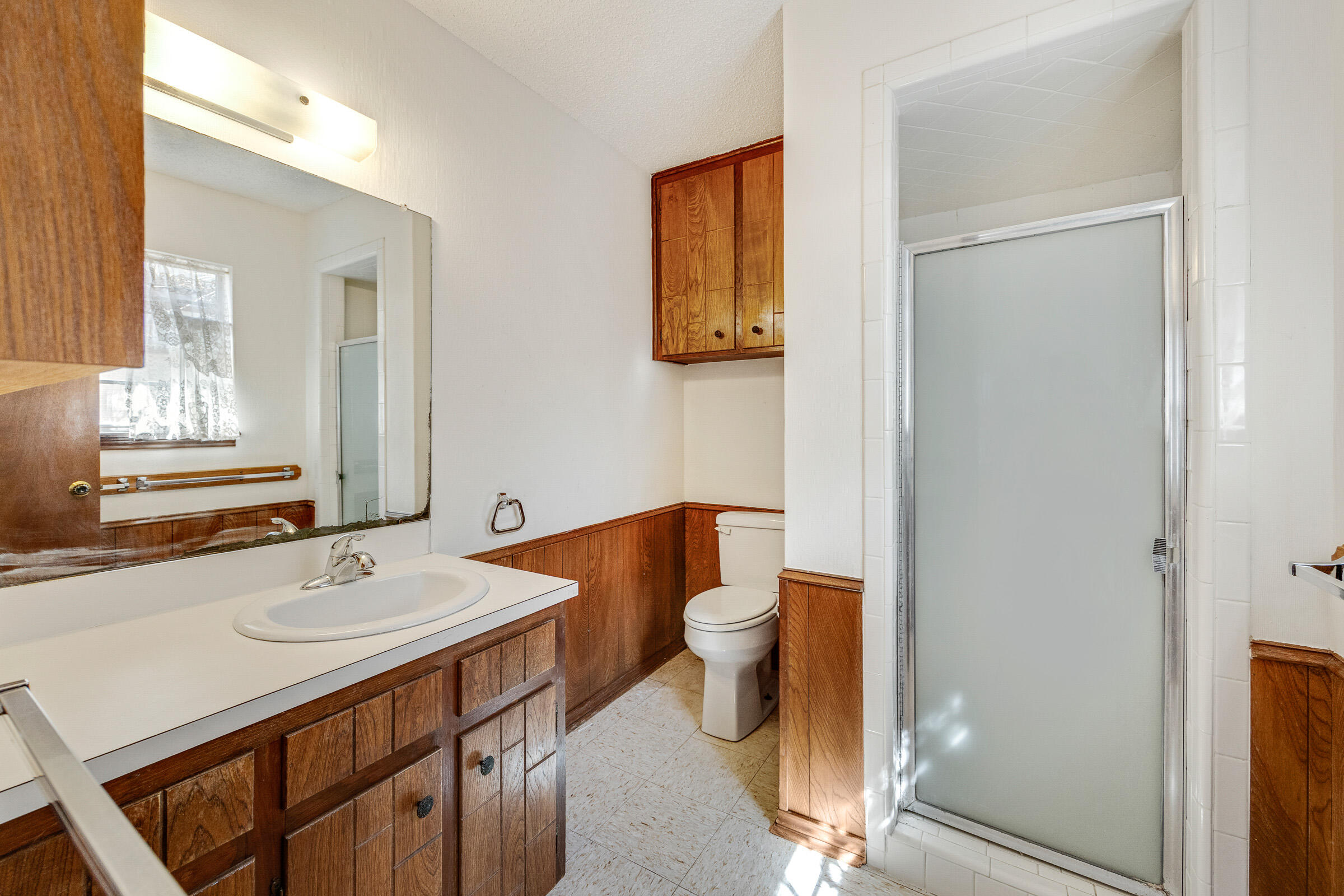 4416 62nd Street Lubbock, TX 79414 - Photo 42 of 70 a bathroom with a sink toilet and mirror
