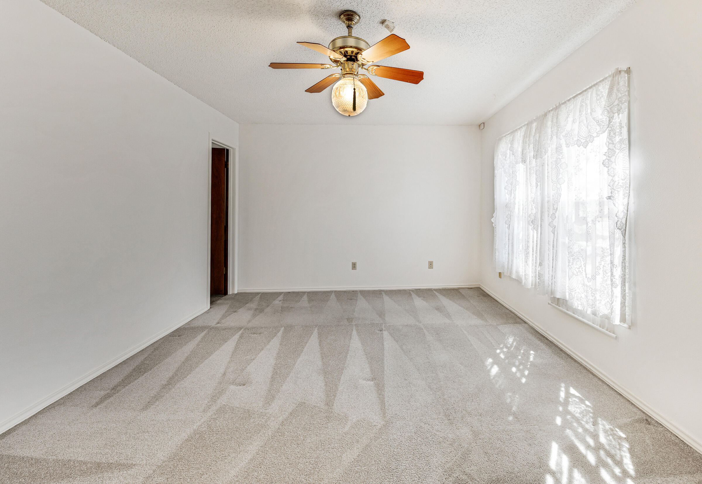 4416 62nd Street Lubbock, TX 79414 - Photo 47 of 70 a view of a room with a window and a fan