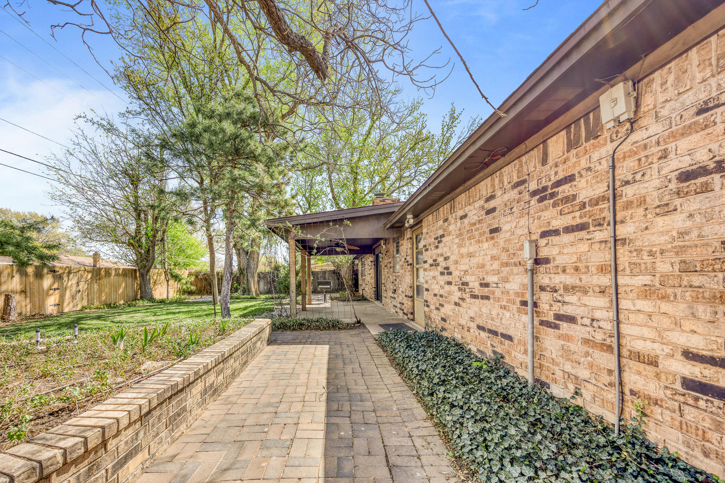 4416 62nd Street Lubbock, TX 79414 - Photo 50 of 70 a path view of a house with a yard