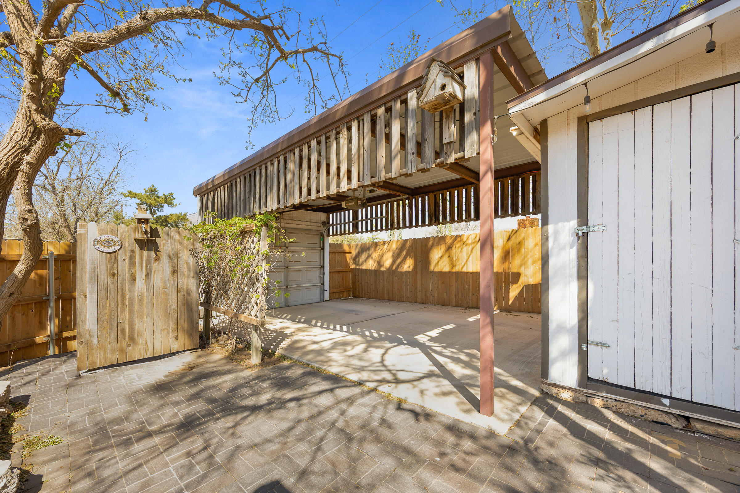 4416 62nd Street Lubbock, TX 79414 - Photo 58 of 70 a view of a house with a wooden deck