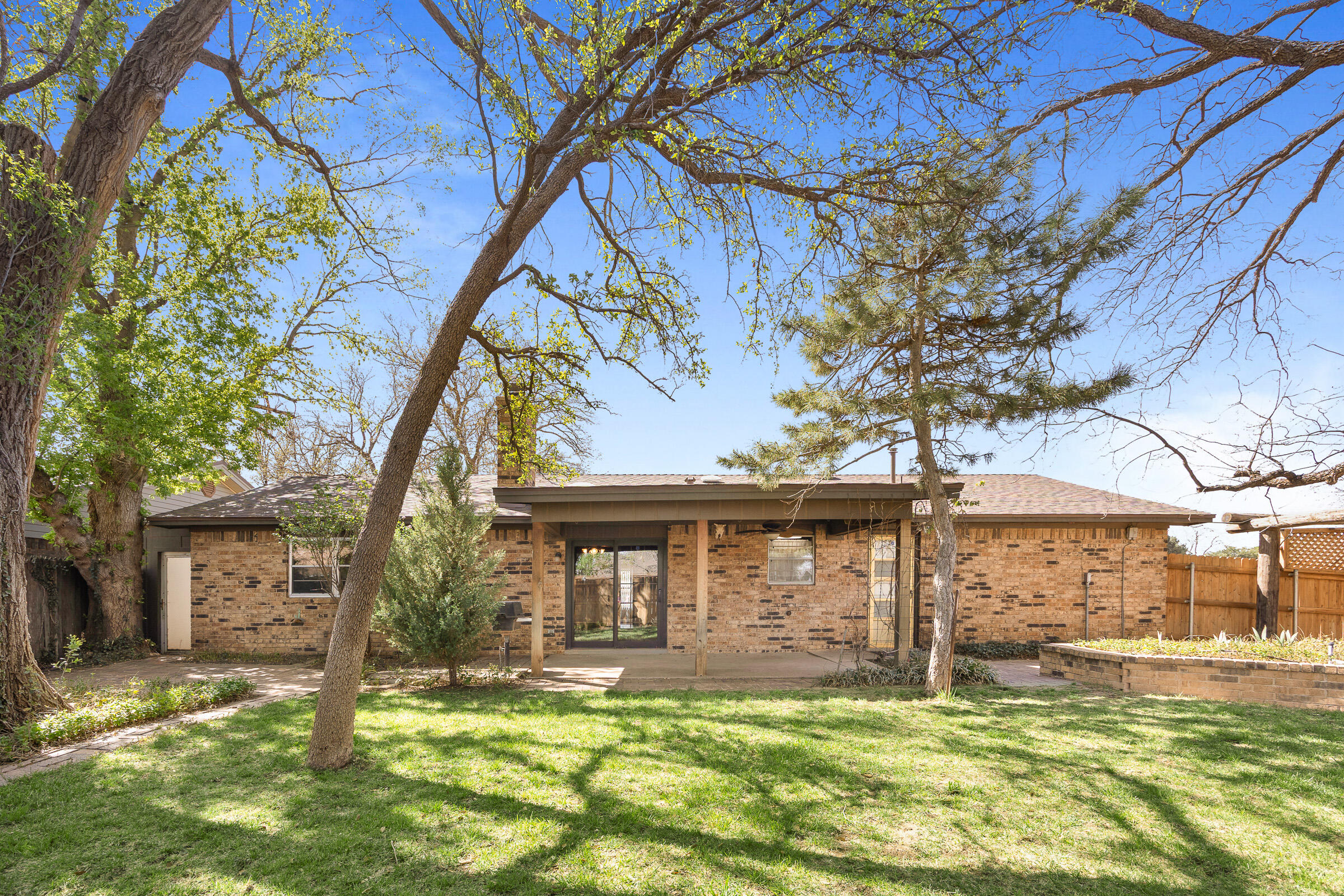 4416 62nd Street Lubbock, TX 79414 - Photo 65 of 70 a view of a house with a yard