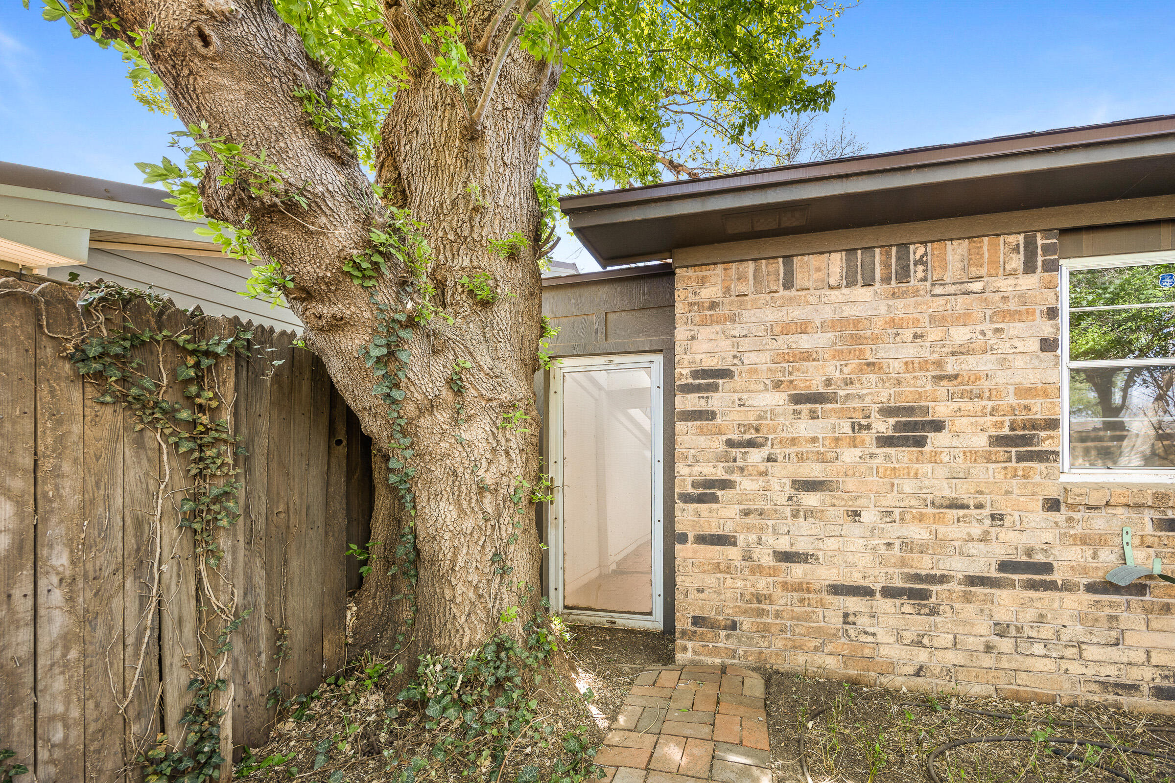 4416 62nd Street Lubbock, TX 79414 - Photo 67 of 70 a front view of a house with a yard