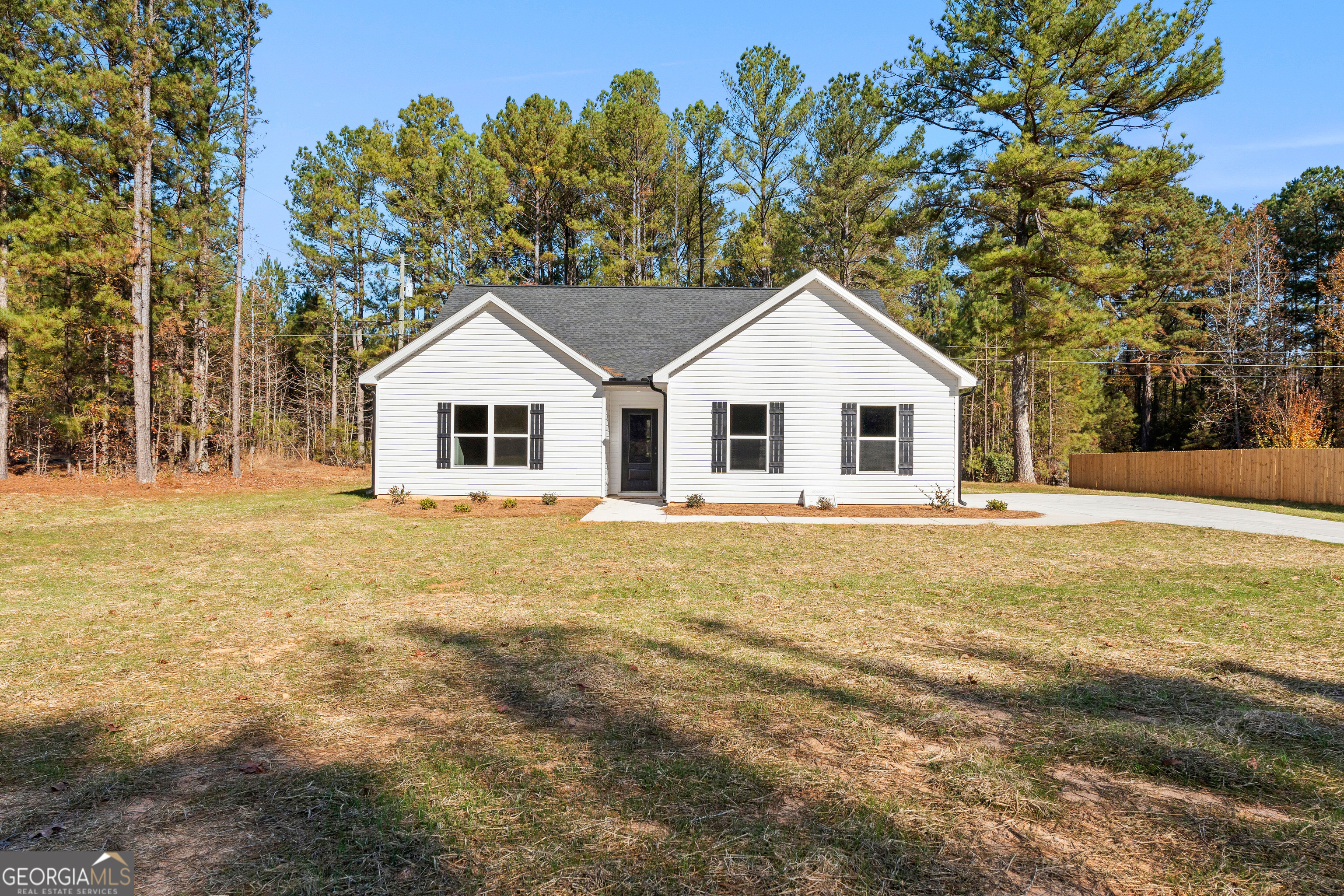 500 Todd Road Greenville, GA 30222 - Photo 1 of 47 a front view of a house with a garden