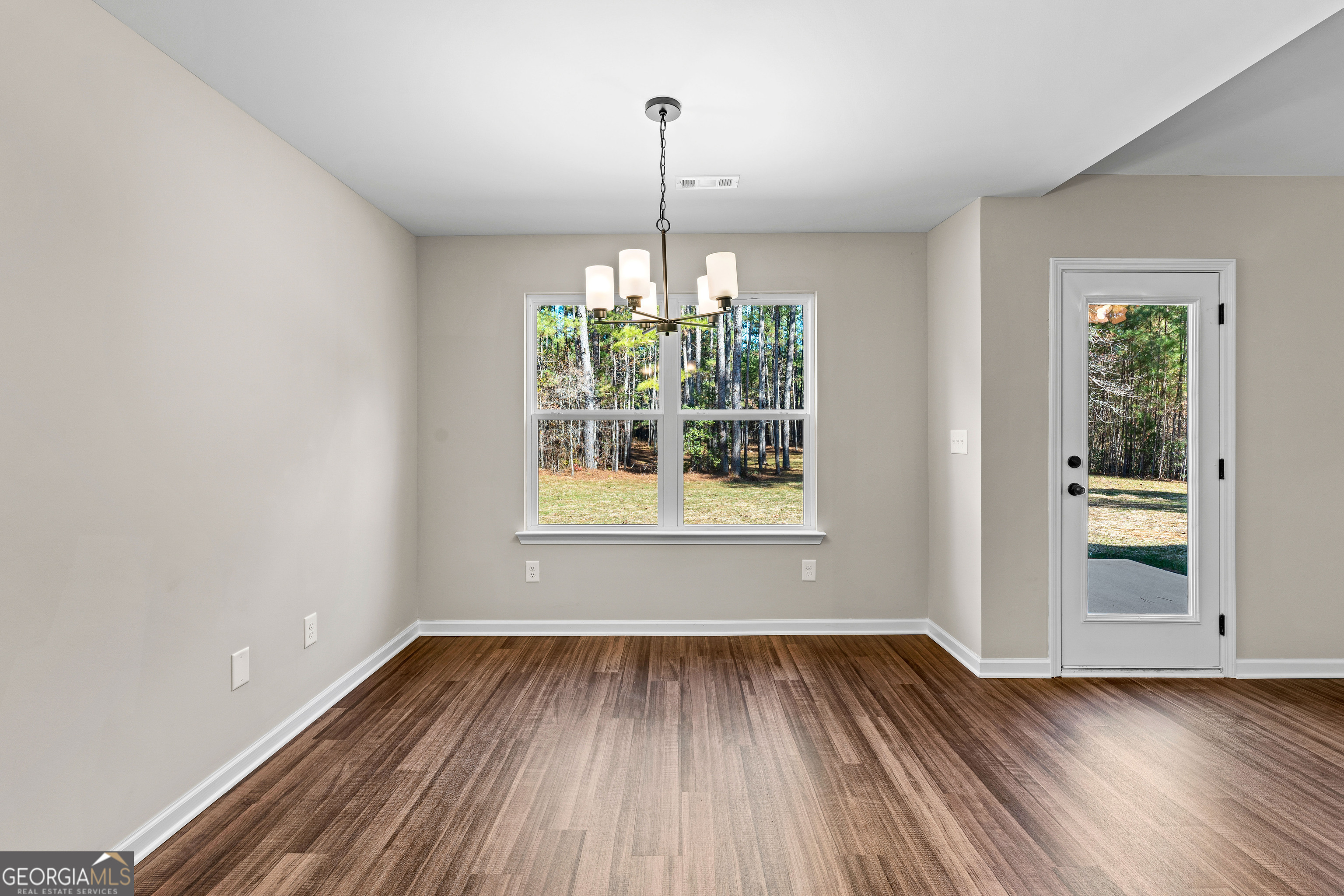 500 Todd Road Greenville, GA 30222 - Photo 12 of 47 a view of empty room with window and wooden floor