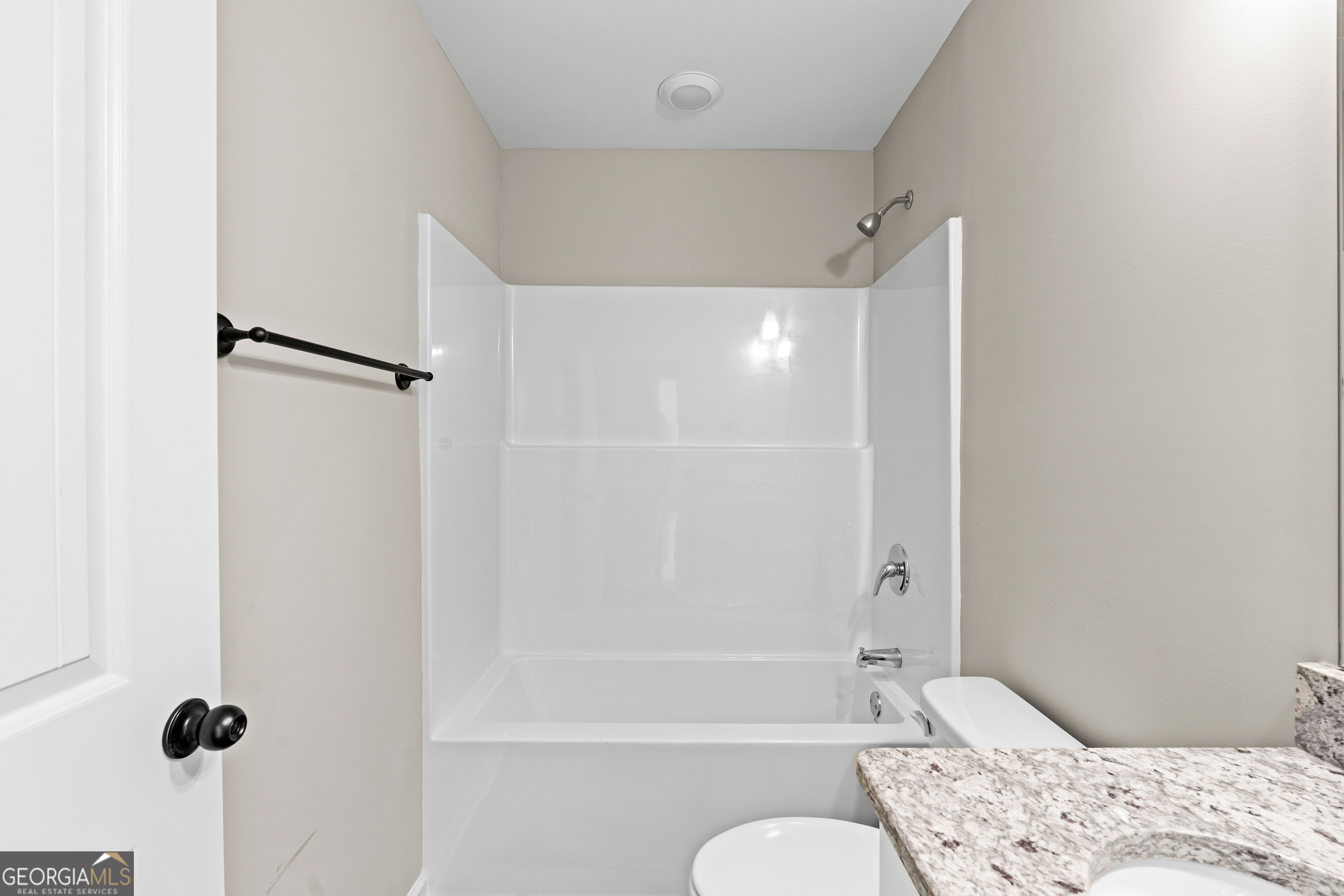 500 Todd Road Greenville, GA 30222 - Photo 22 of 47 a bathroom with a bathtub shower sink and a toilet