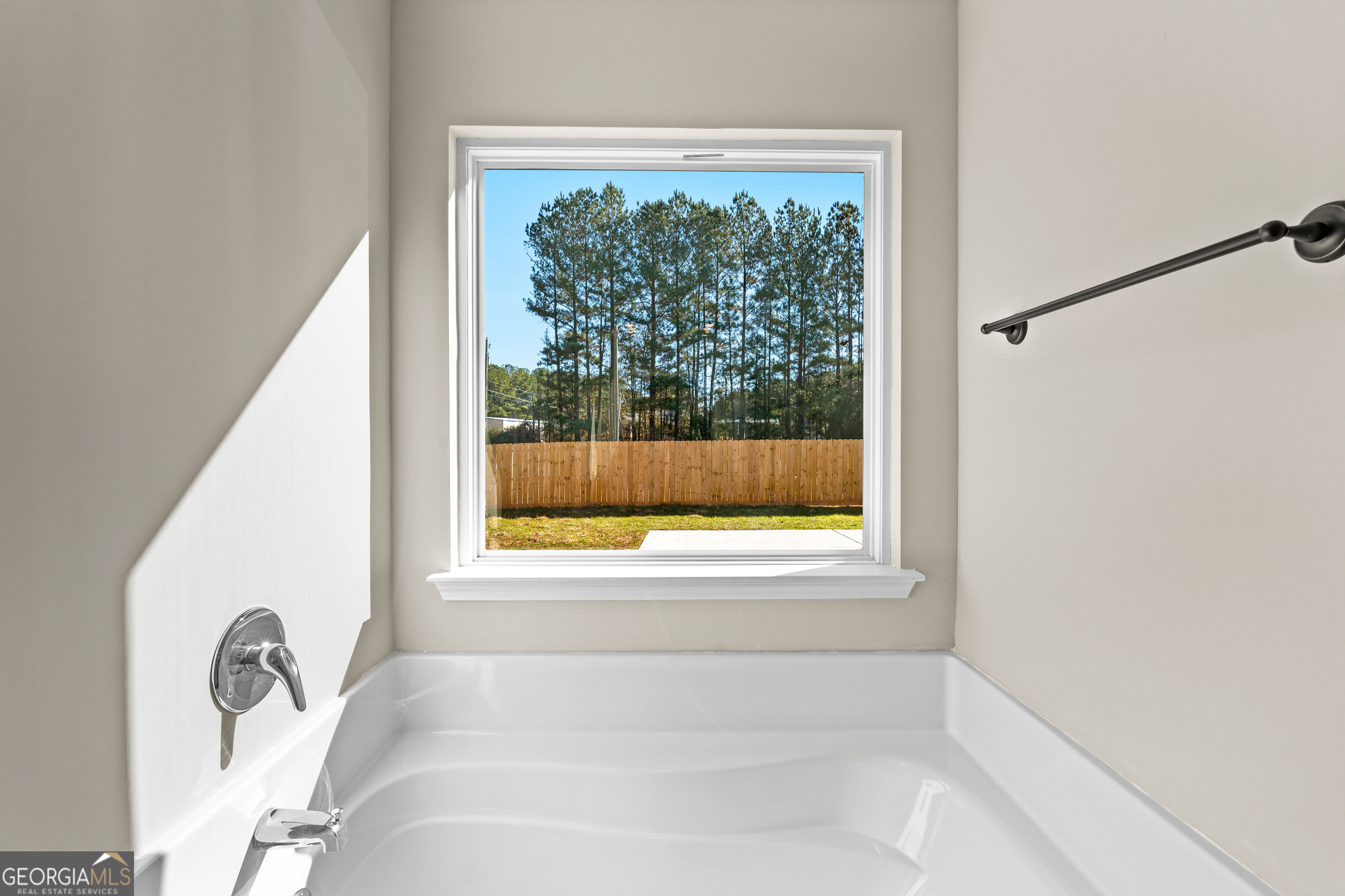 500 Todd Road Greenville, GA 30222 - Photo 34 of 47 a bathroom with a bathtub and window