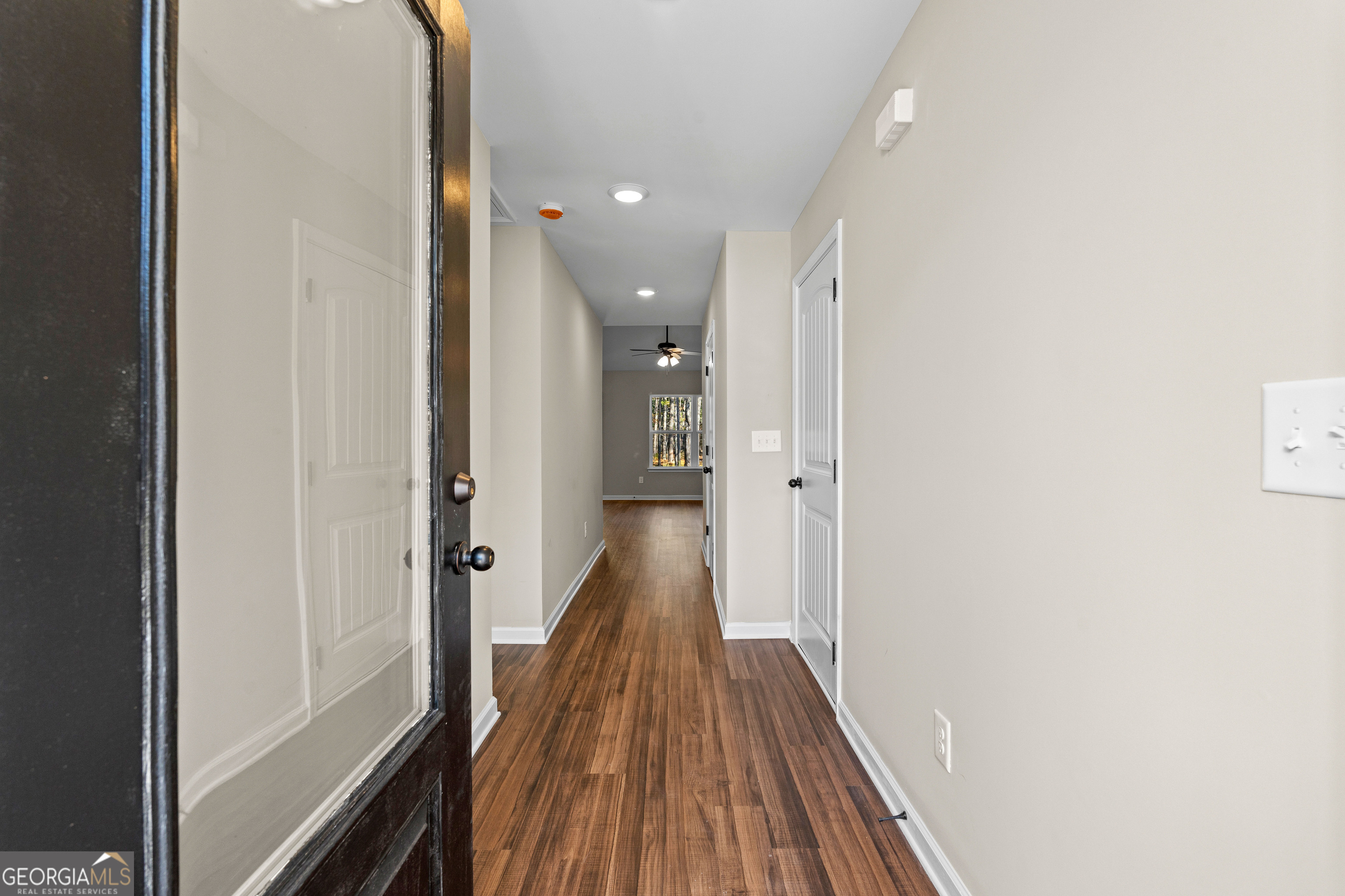 500 Todd Road Greenville, GA 30222 - Photo 7 of 47 a view of a hallway with wooden floor and staircase