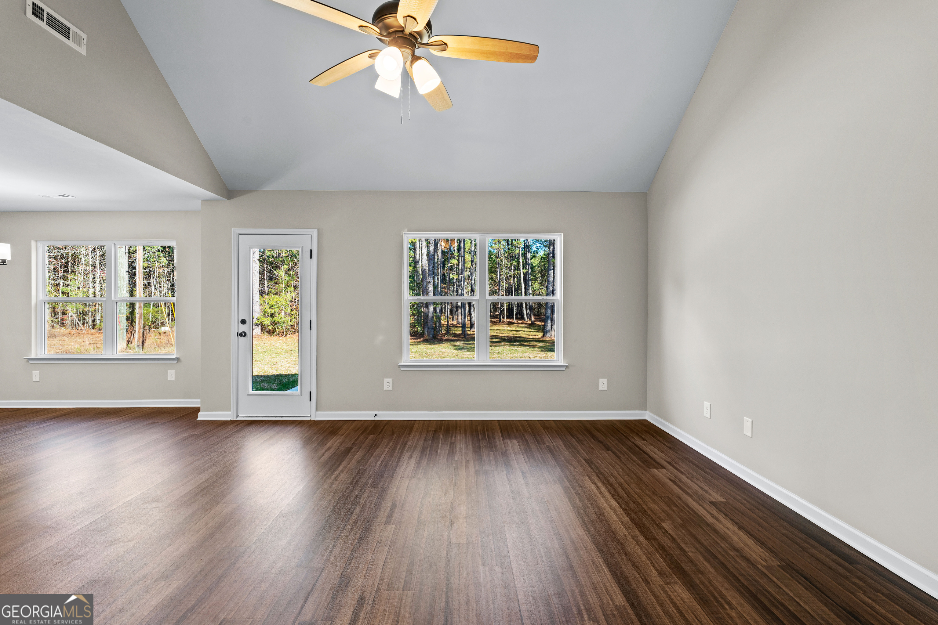 500 Todd Road Greenville, GA 30222 - Photo 8 of 47 a view of an empty room with wooden floor and a window