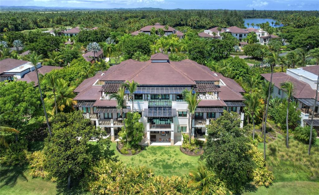 4333 Las Verandas, Unit PH Rio Grande, PR 00745 - Photo 1 of 1 an aerial view of a house with a yard and lake view
