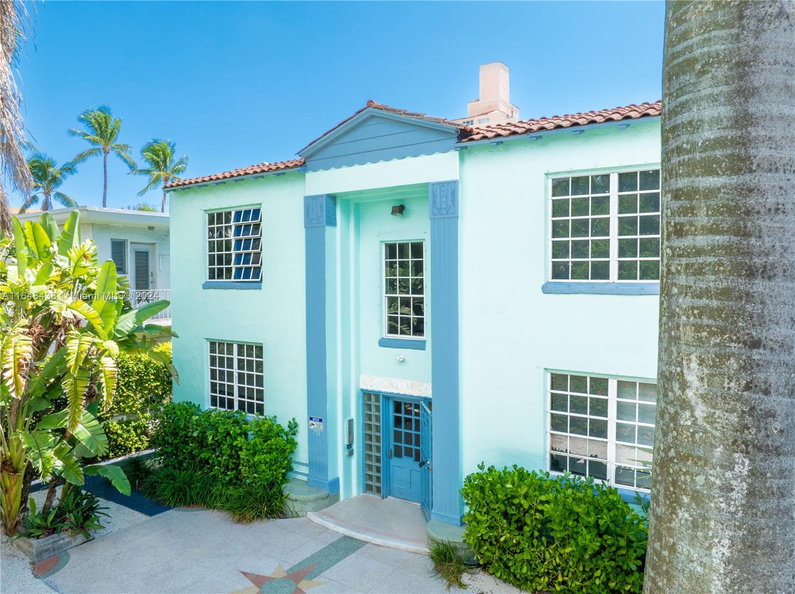 751 Euclid Avenue Miami Beach, FL 33139 - Photo 3 of 13 a front view of a house with a yard