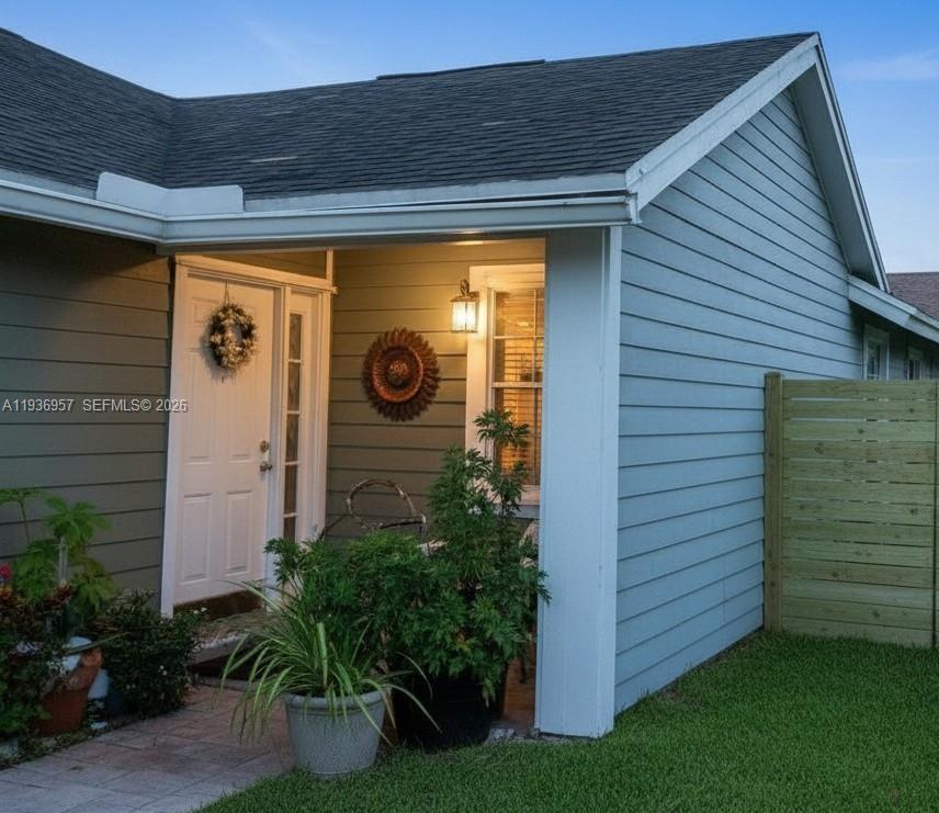 14035 Southwest 103rd Terrace Miami, FL 33186 - Photo 12 of 13 a view of front door and potted plants