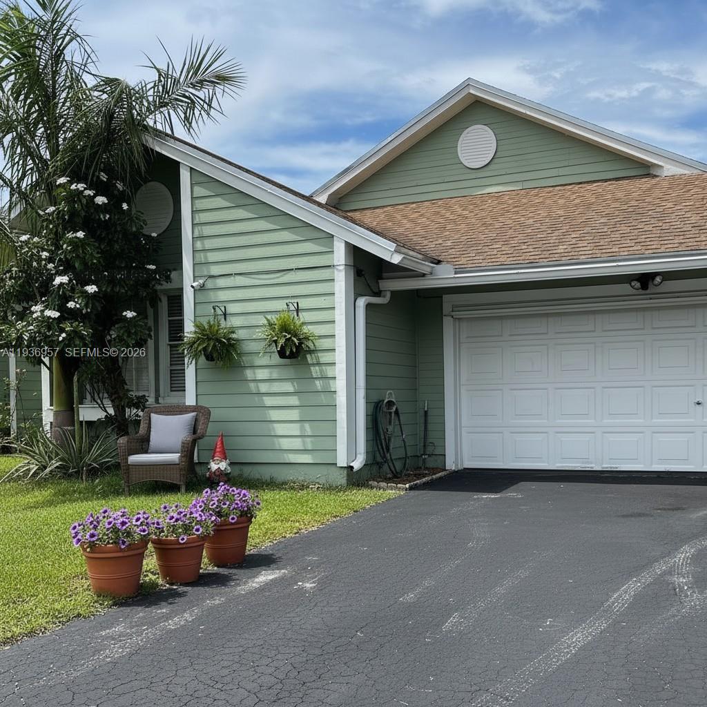 14035 Southwest 103rd Terrace Miami, FL 33186 - Photo 2 of 13 a front view of a house