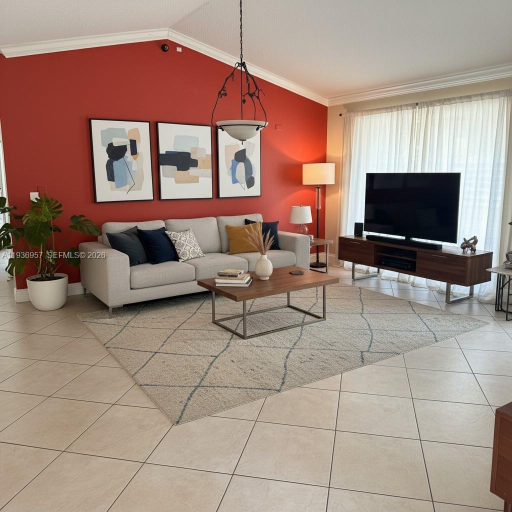 14035 Southwest 103rd Terrace Miami, FL 33186 - Photo 4 of 13 a living room with furniture and a flat screen tv