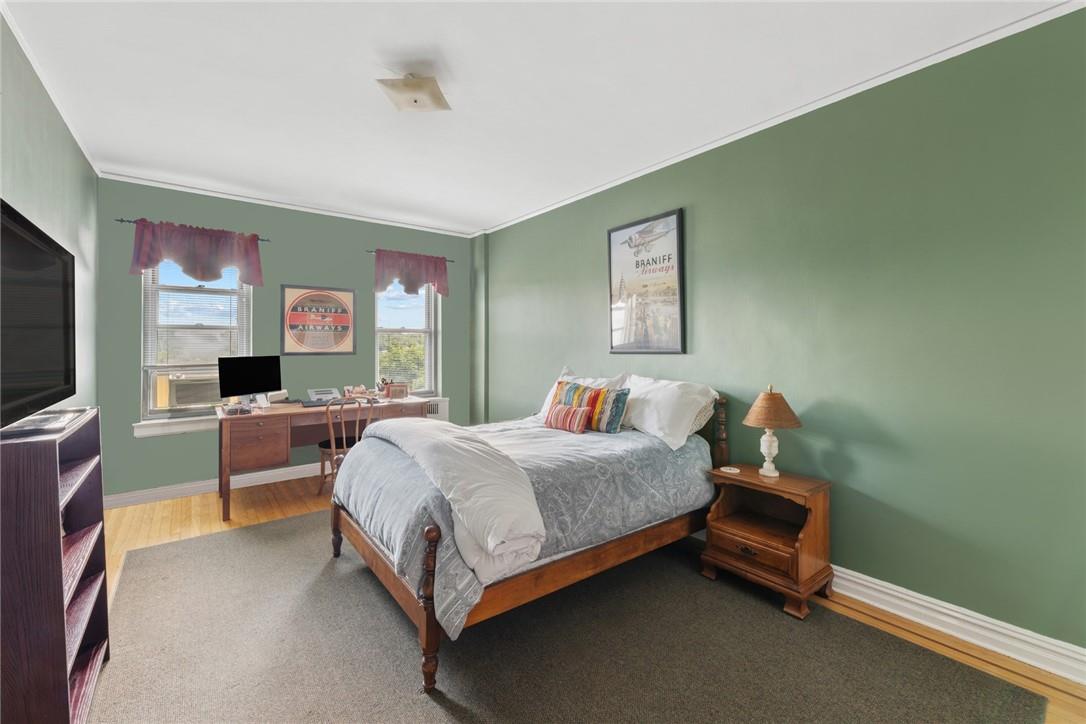 4445 Post Road, Unit 7D Bronx, NY 10471 - Photo 11 of 13 Bedroom with ornamental molding and hardwood / wood-style floors